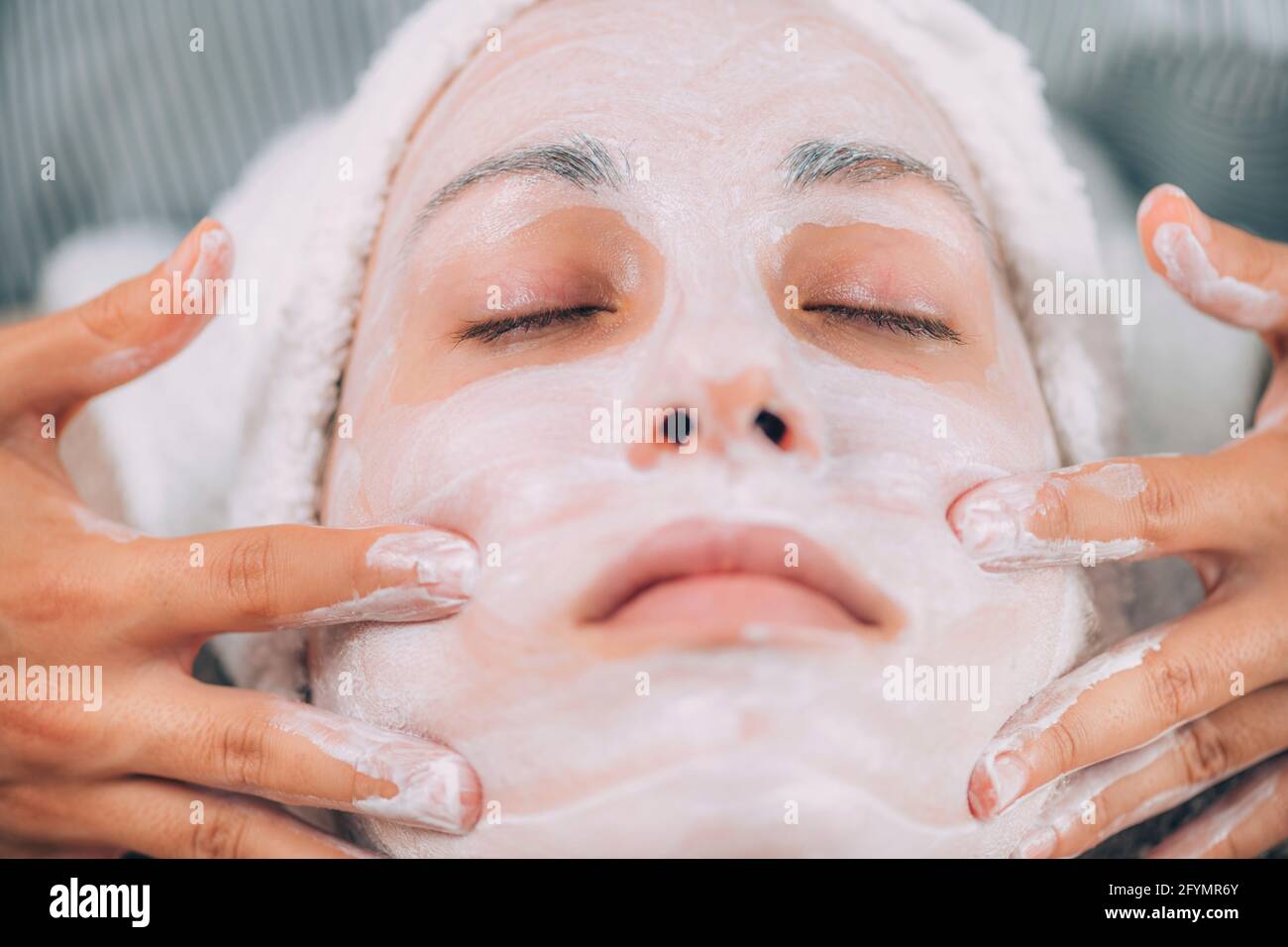 Jawline rejuvenating face mask treatment Stock Photo