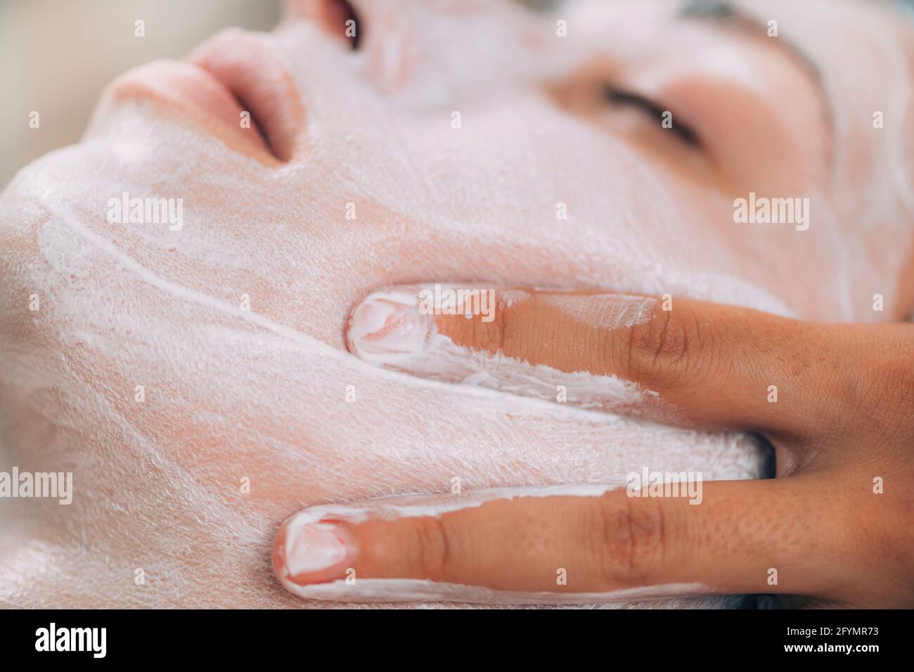 Jawline rejuvenating face mask treatment Stock Photo Alamy