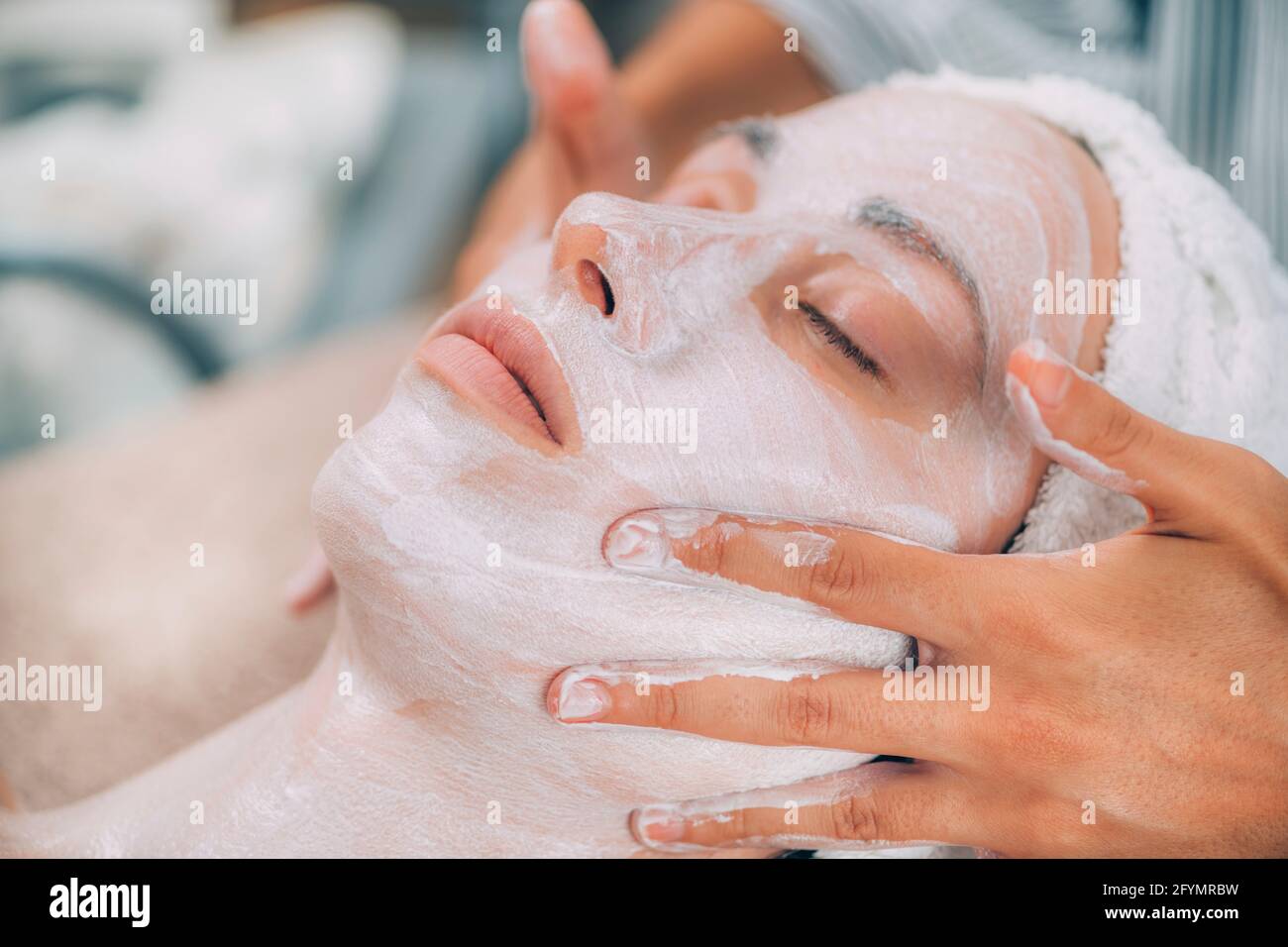 Rejuvenating facial skin mask treatment Stock Photo