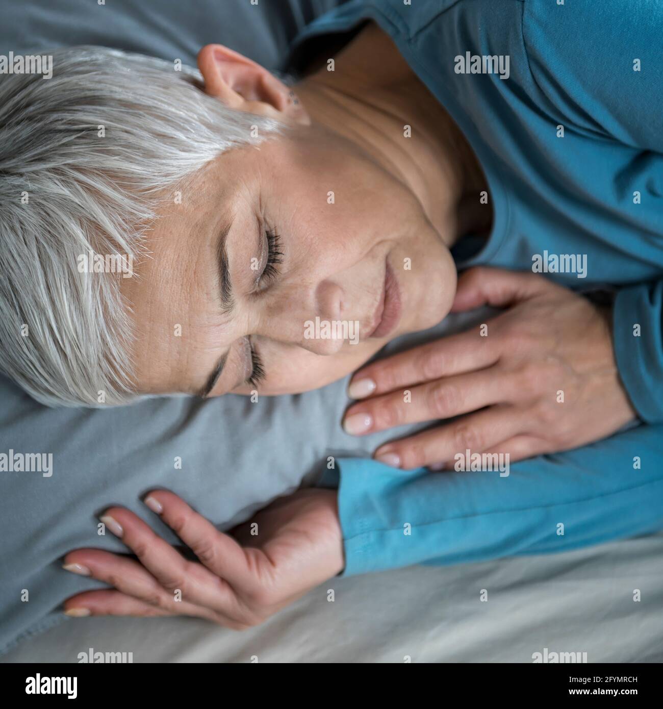 Mature woman asleep bed hi-res stock photography and images - Alamy