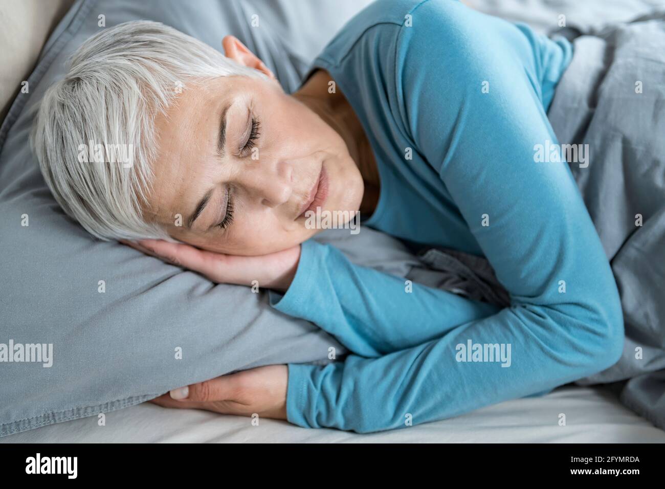 Mature woman asleep bed hi-res stock photography and images - Alamy