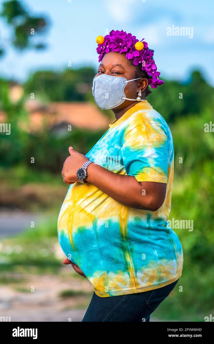 Pregnant woman wearing face mask Stock Photo Alamy