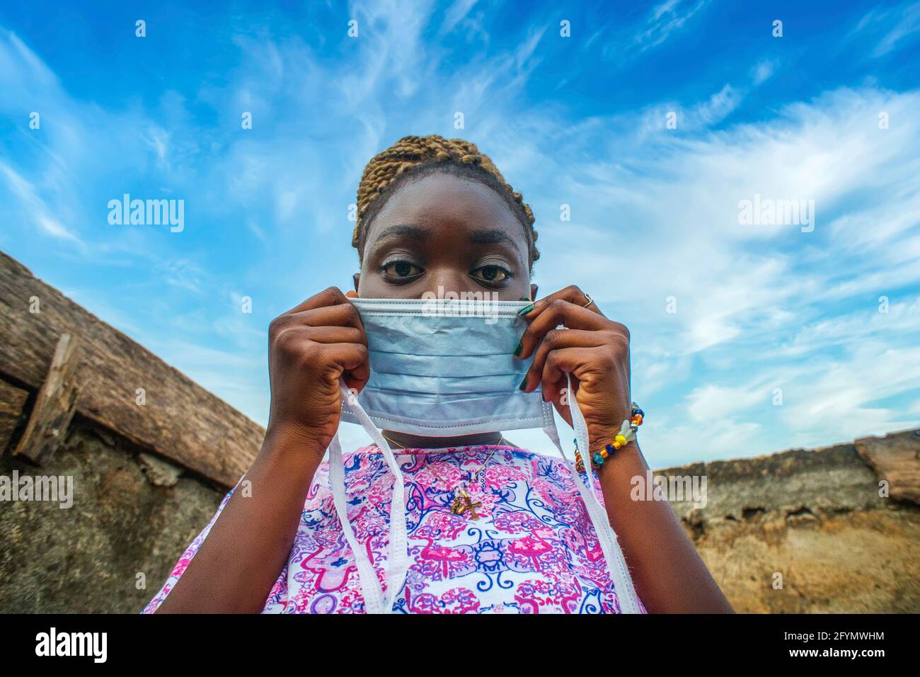 African woman wearing mask hi-res stock photography and images - Alamy