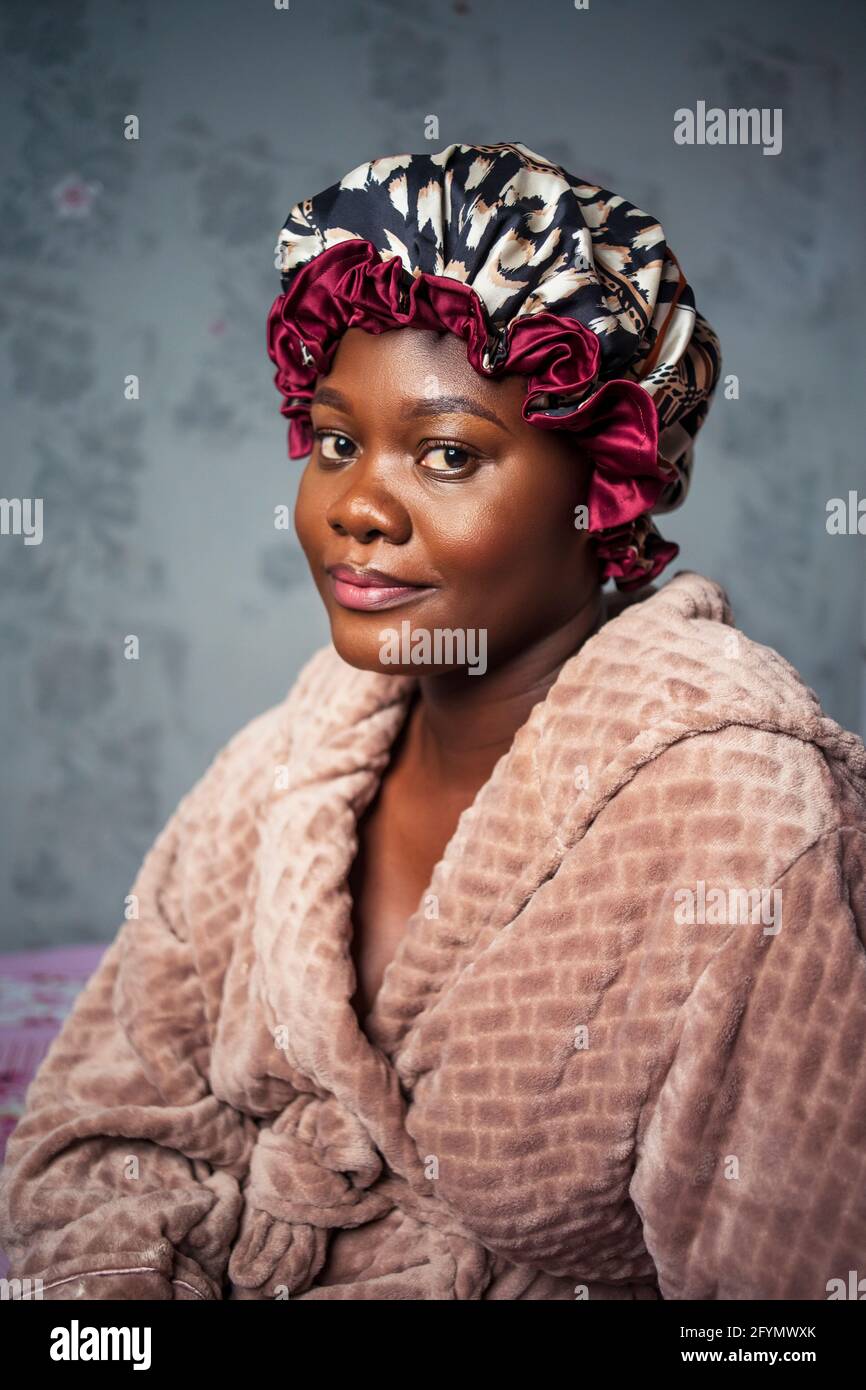 Woman in dressing gown and hair Stock Photo Alamy
