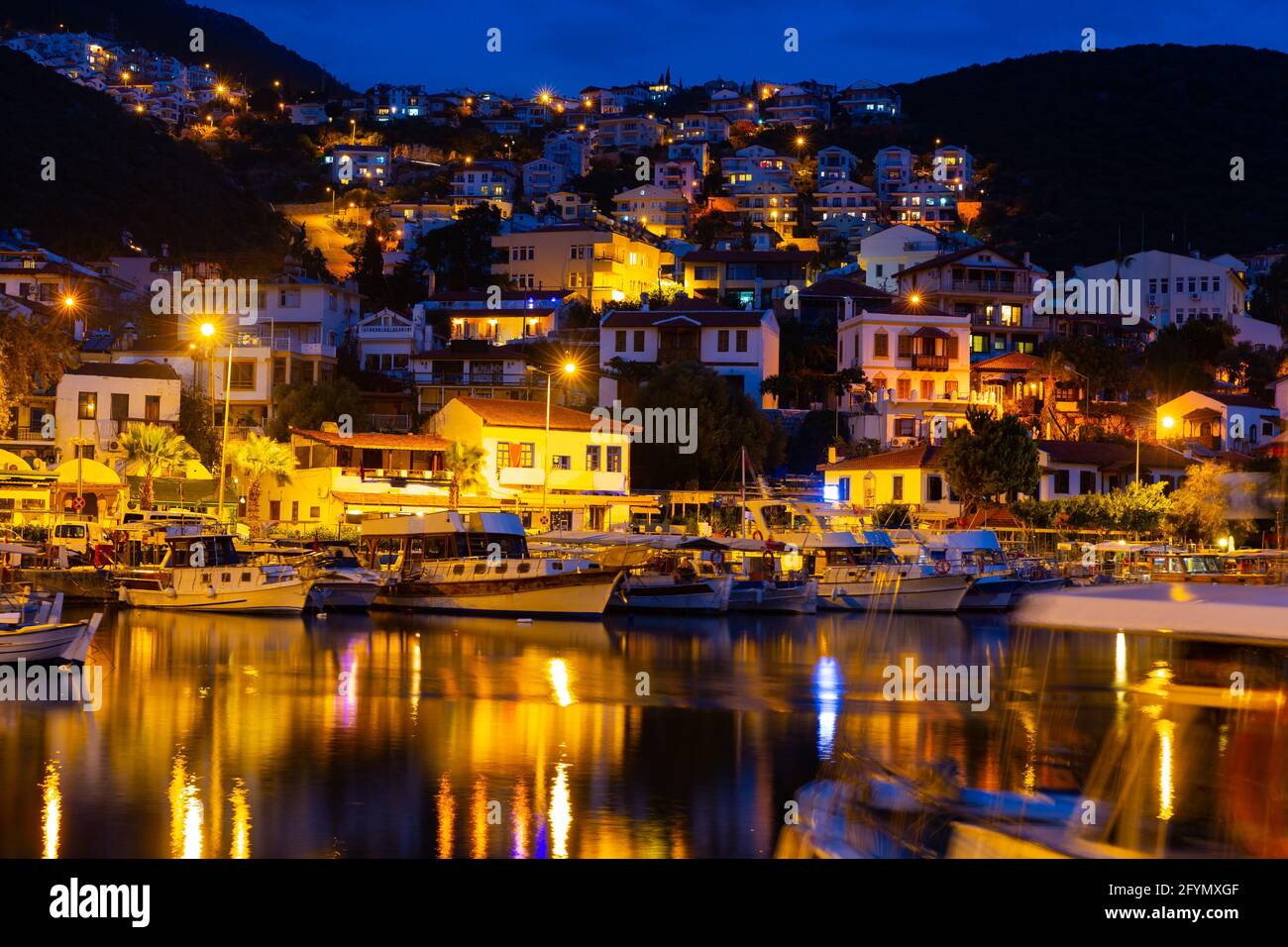 Kas Harbour at night as viewed from the sea, Lycian Coast, Turkey Stock Photo