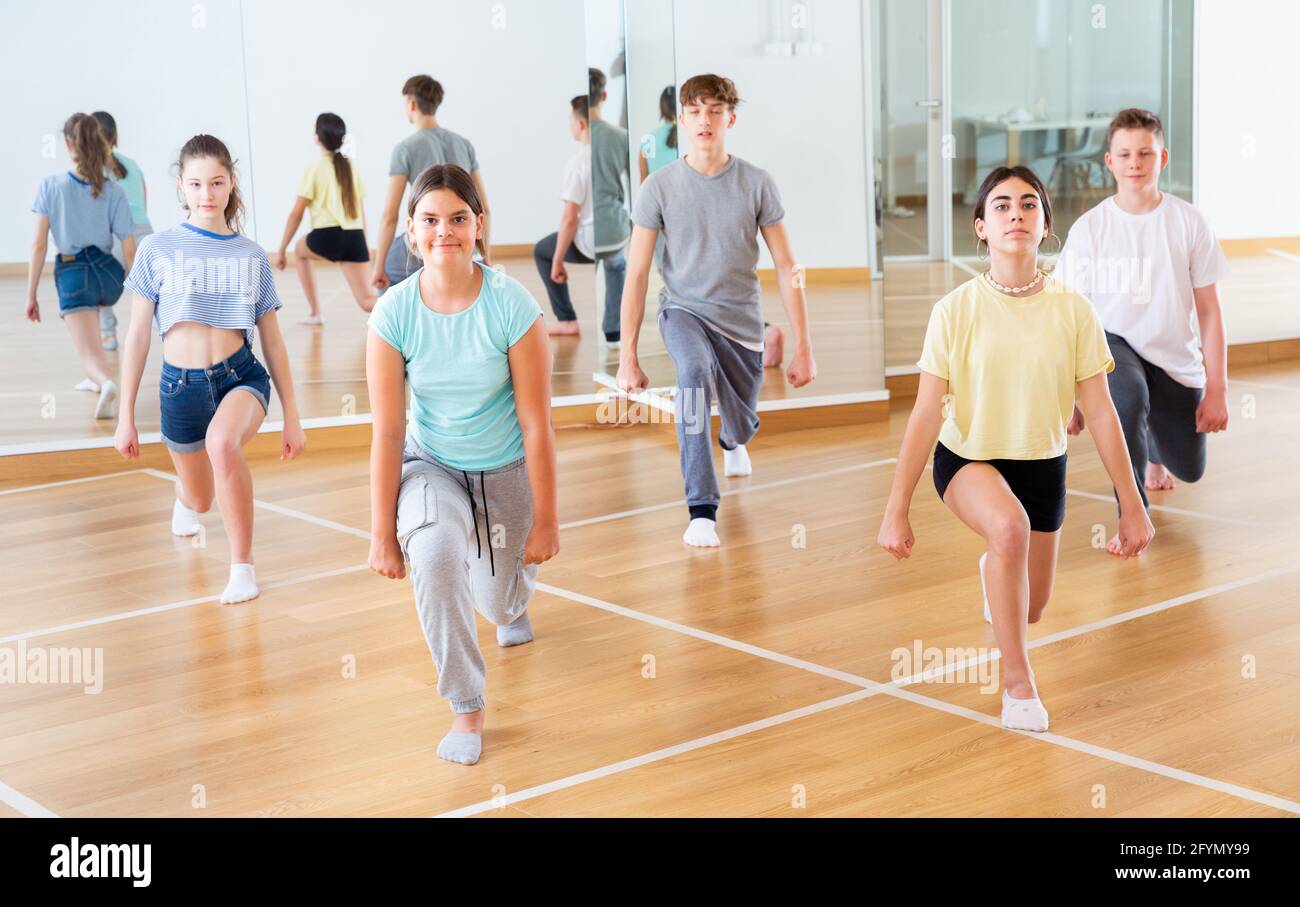 Active teens learn new dance moves in dance studio Stock Photo Alamy
