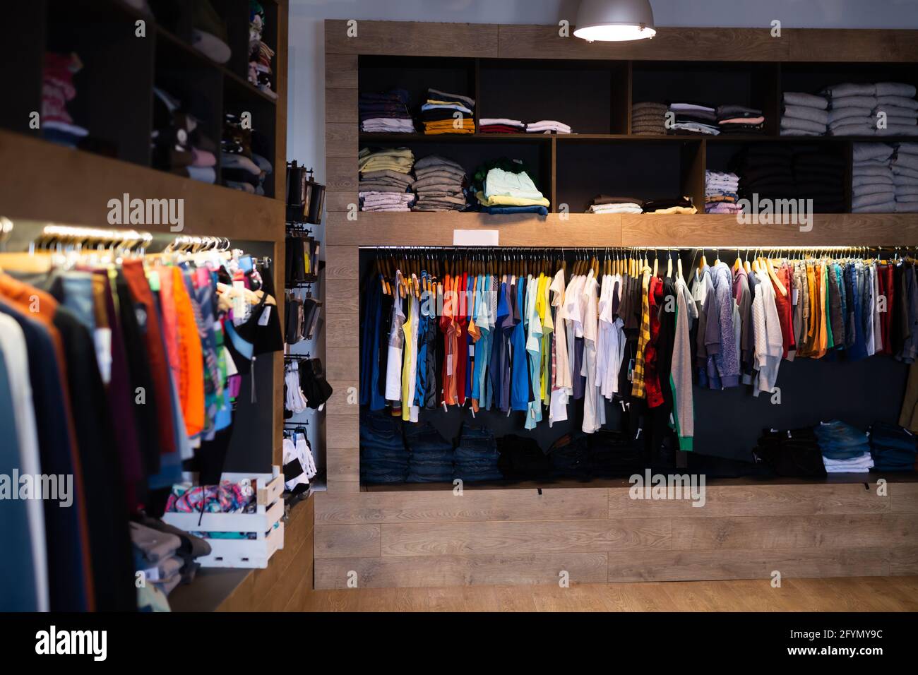 Men clothing shop, casual clothes on hangers and shelves in apparel store  Stock Photo - Alamy