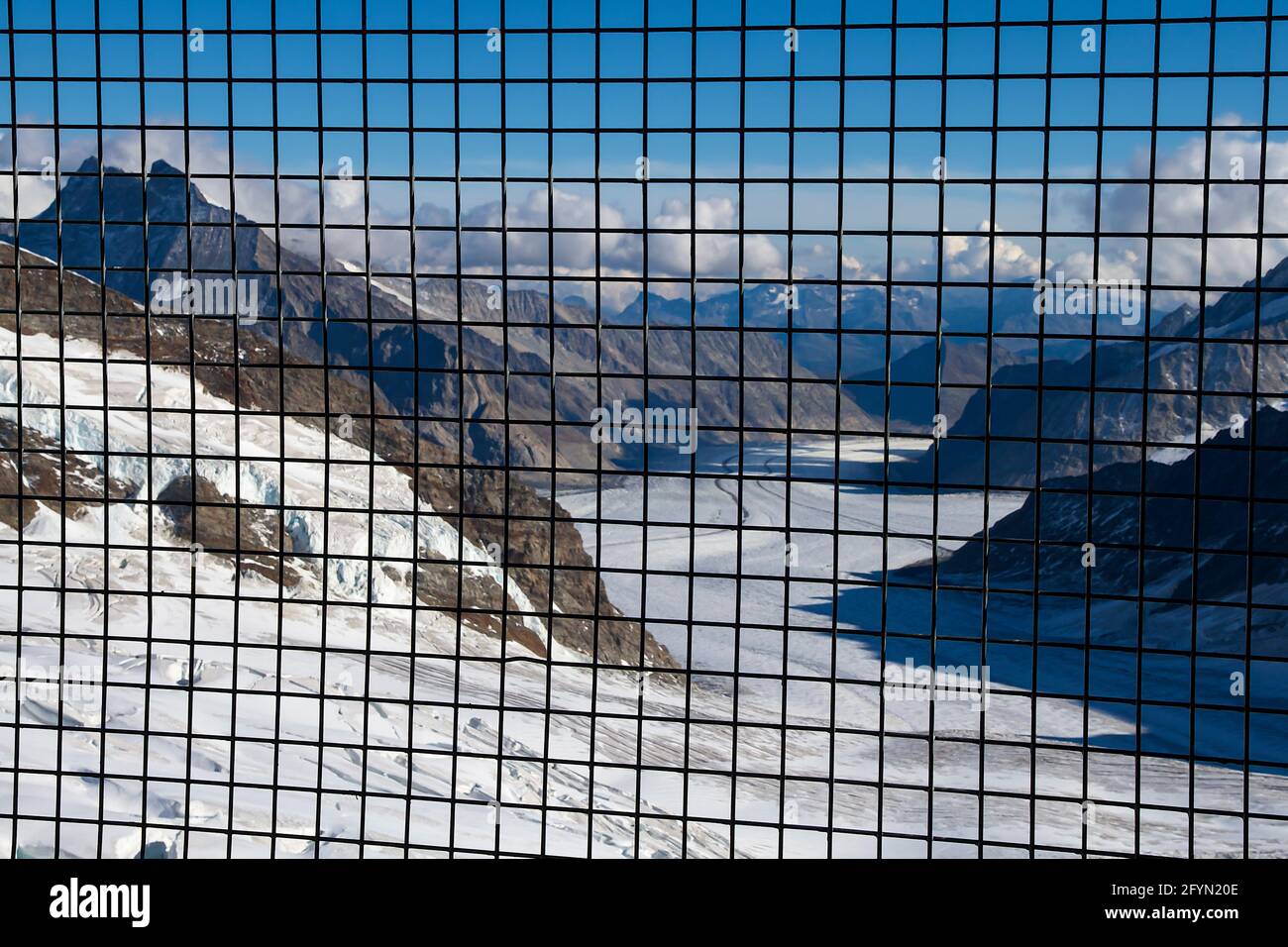 Jungfraujoch, Switzerland - September 30, 2011: Glacier valley at the mountain of Jungfraujoch behind the metal net Stock Photo