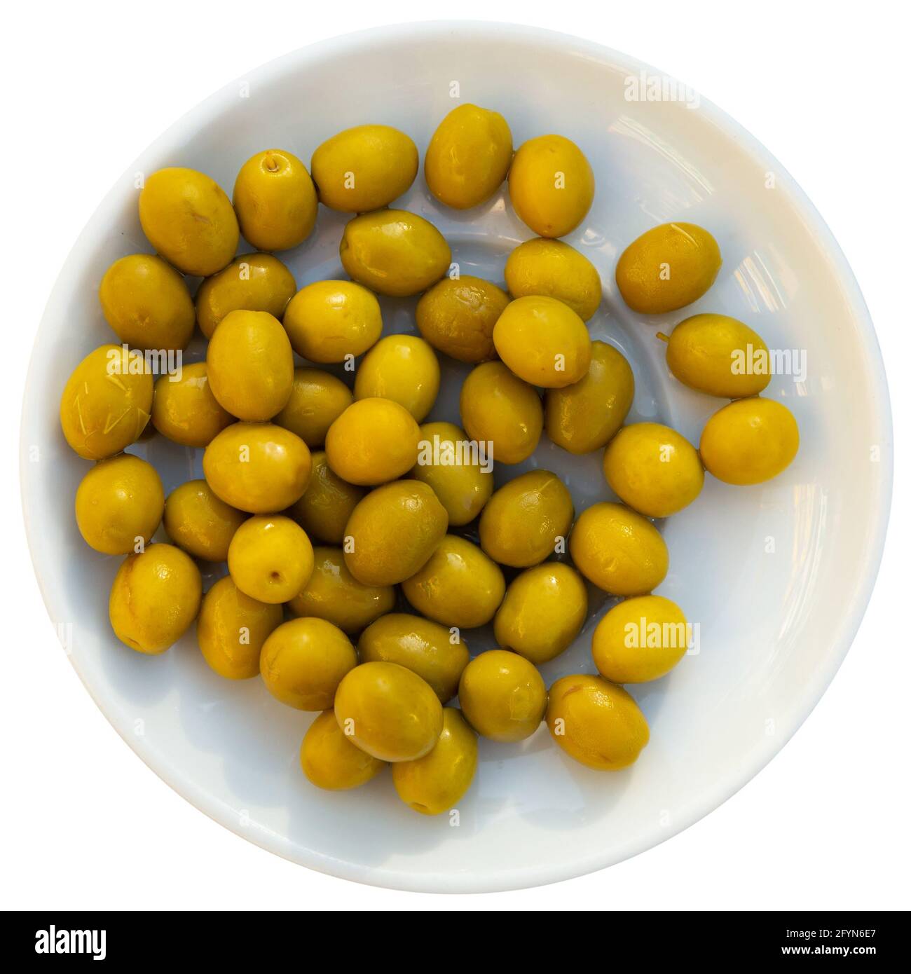 Marinated whole green olives served as snack. Traditional Spanish appetizer. Isolated over white background Stock Photo