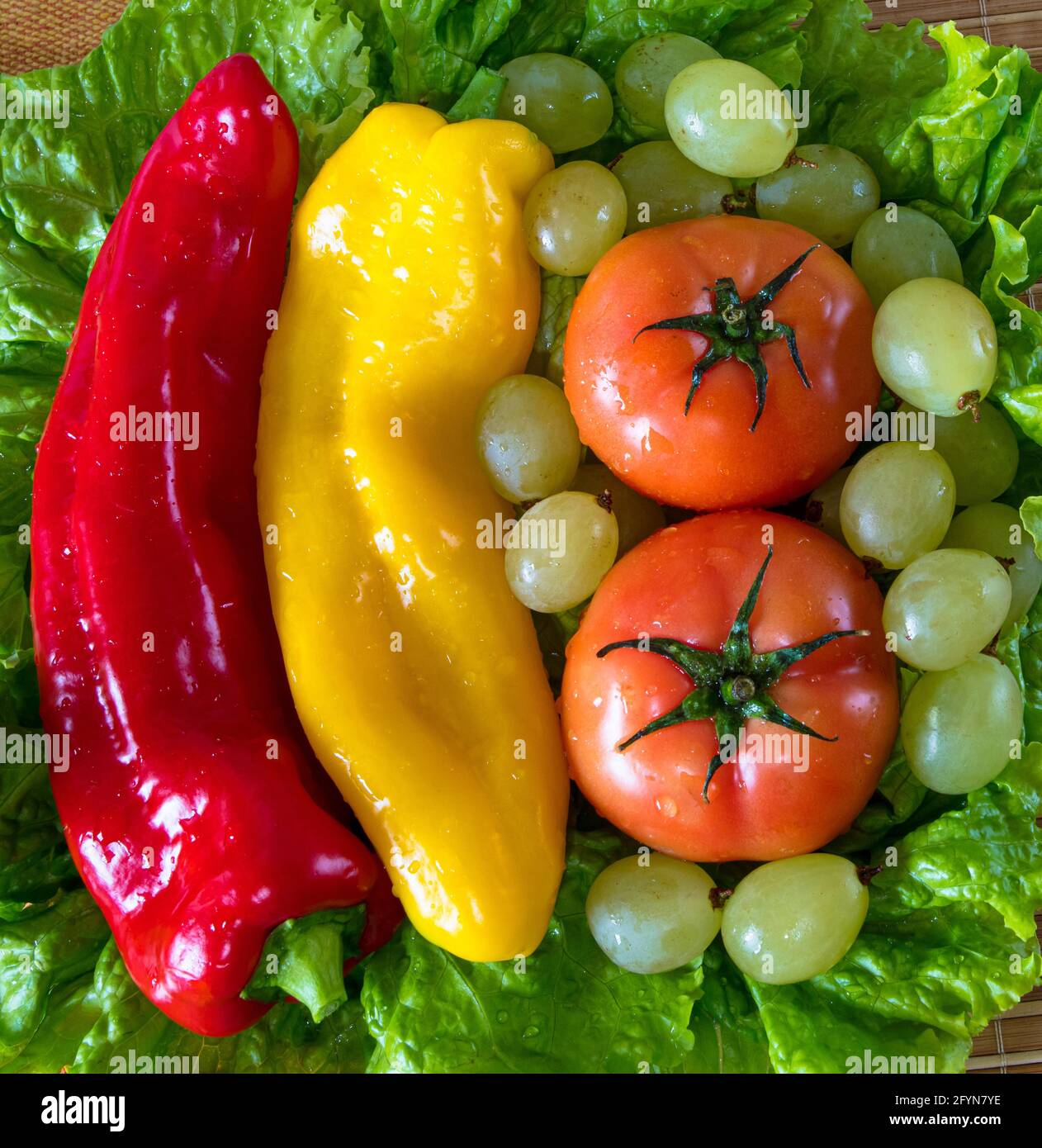 Closeup shot of peppers, tomatoes, and grapes Stock Photo