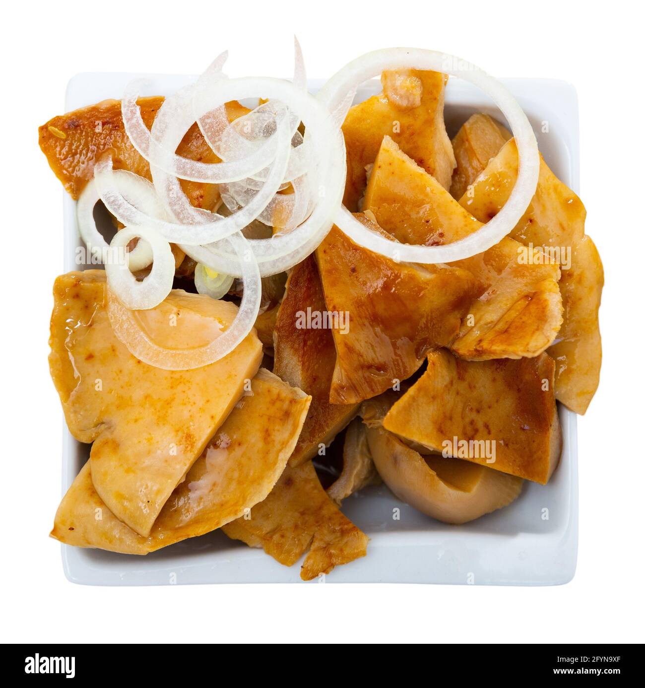 Salad bowl with pickled brittlegills (Russula delica) and thin sliced white onions. Delicious homemade pickles. Isolated over white background Stock Photo