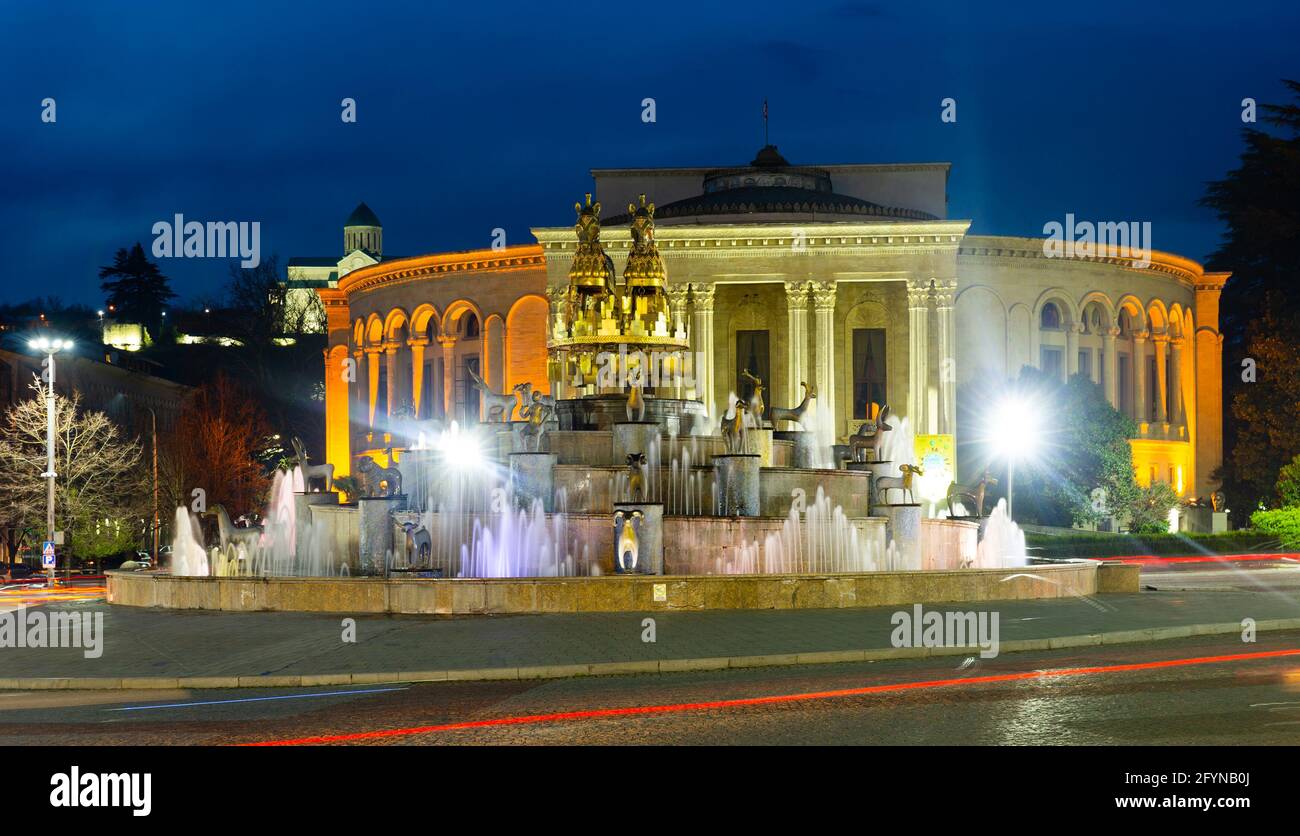 Night view of grandiose composition of Colchis Fountain on main square of Kutaisi on background of Lado Meskhishvili State Academic Theatre in spring, Stock Photo