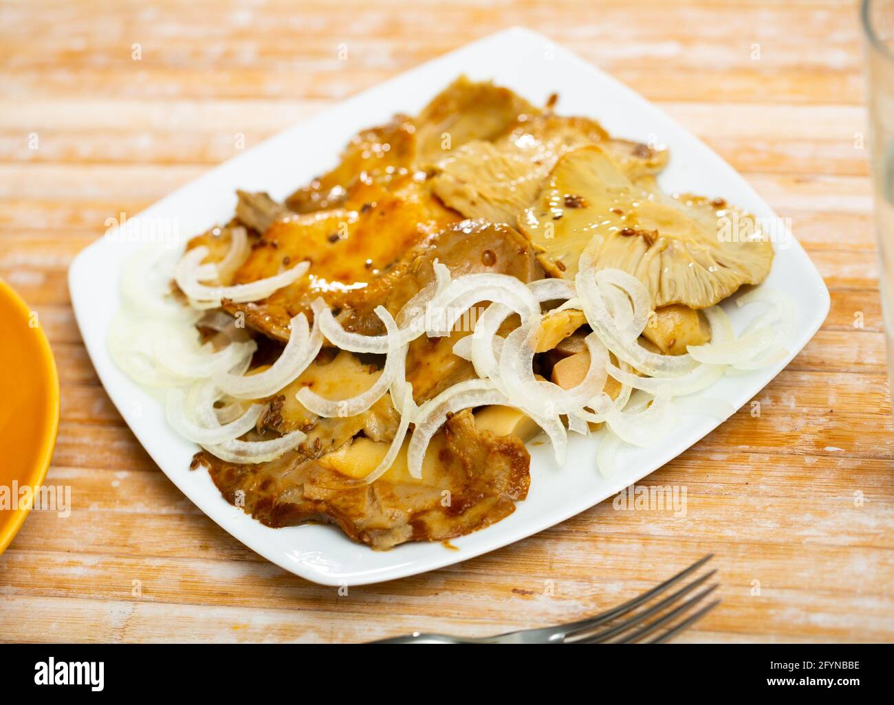 Delicious pickled russula delica, sprinkled with onion rings on top Stock Photo