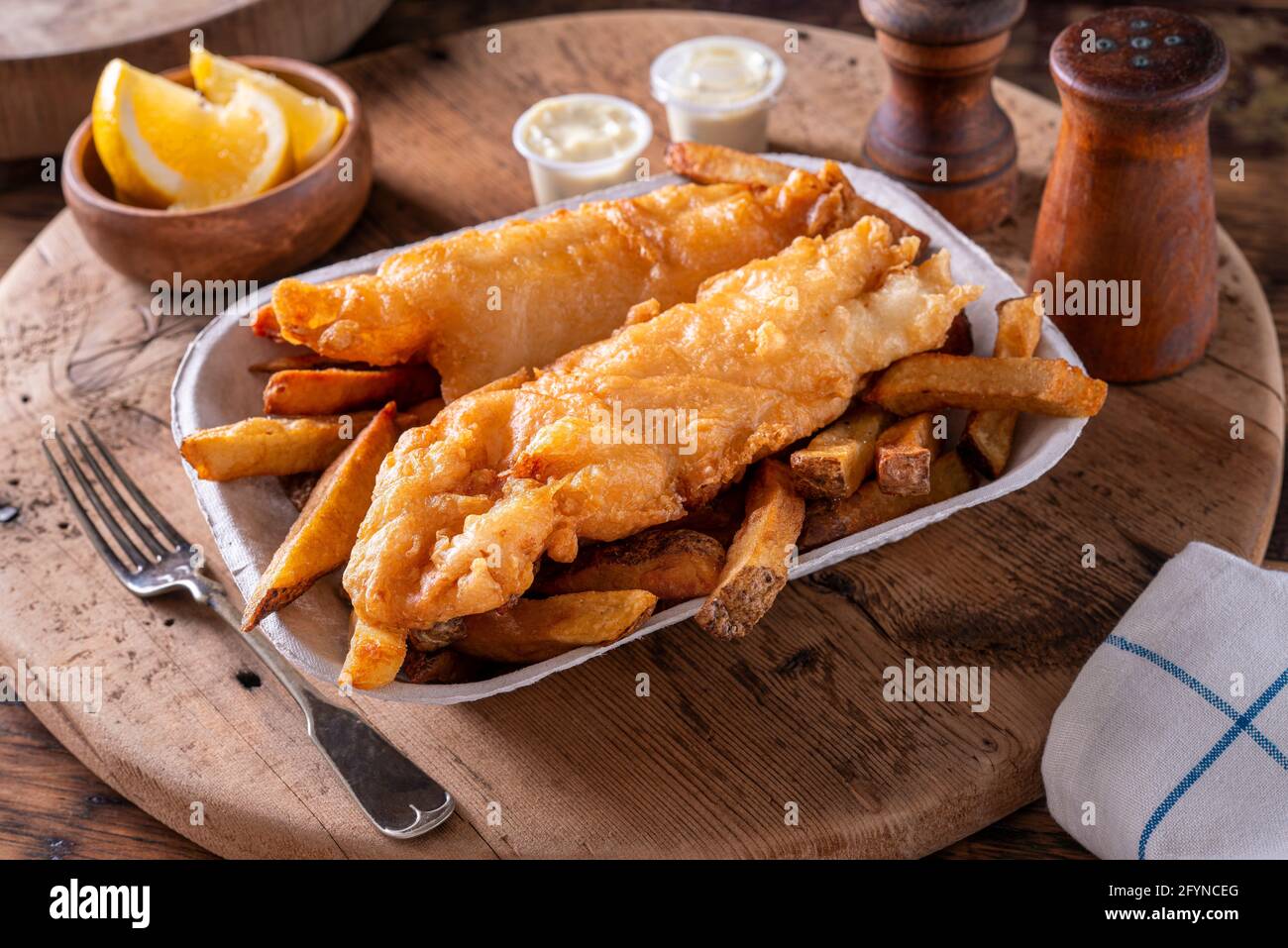 Delicious batter fried fish and chips. Stock Photo