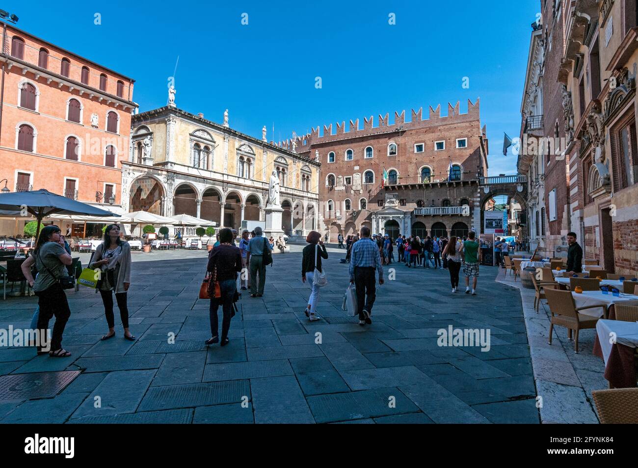 Tourists wandering in Piazza dei Signor in the medieval city of Verona in the Veneto region of northern Italy. Stock Photo