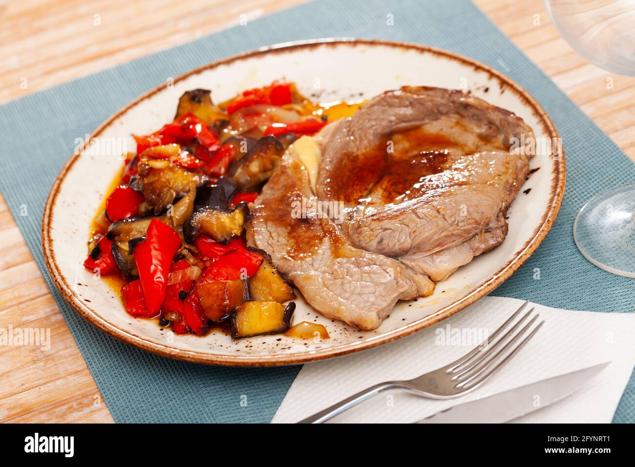 Homemade veal steak with grilled zucchini, tomato, onion, pepper Stock