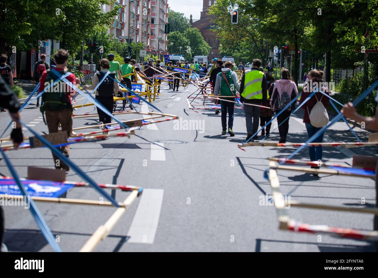 Berlin, Germany. 29th May, 2021. In an action of 'Volksentscheid Berlin autofrei' and Greenpeace Berlin, wooden racks, which are supposed to represent the average space consumption of cars, are used to demonstrate against land consumption by cars. Credit: Christophe Gateau/dpa/Alamy Live News Stock Photo