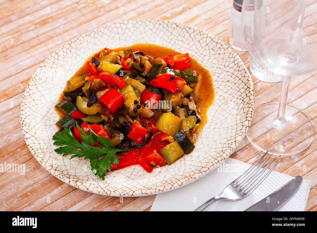 Stew with peppers, zucchini and zucchini in plate.Traditional Hungarian dish called lecho Stock Photo