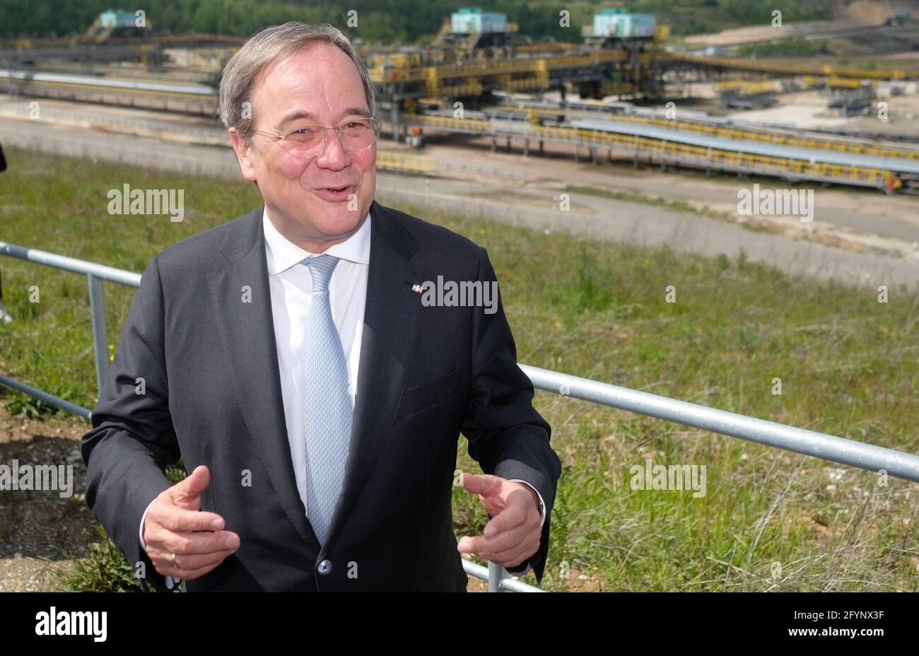 Profen, Germany. 29th May, 2021. Armin Laschet (CDU), Minister President of North Rhine-Westphalia and candidate for the chancellorship of the CDU/CSU, stands at an open-cast lignite mine. In Saxony-Anhalt, a new state parliament will be elected on 06.06.2021. Credit: Sebastian Willnow/dpa-Zentralbild/dpa/Alamy Live News Stock Photo