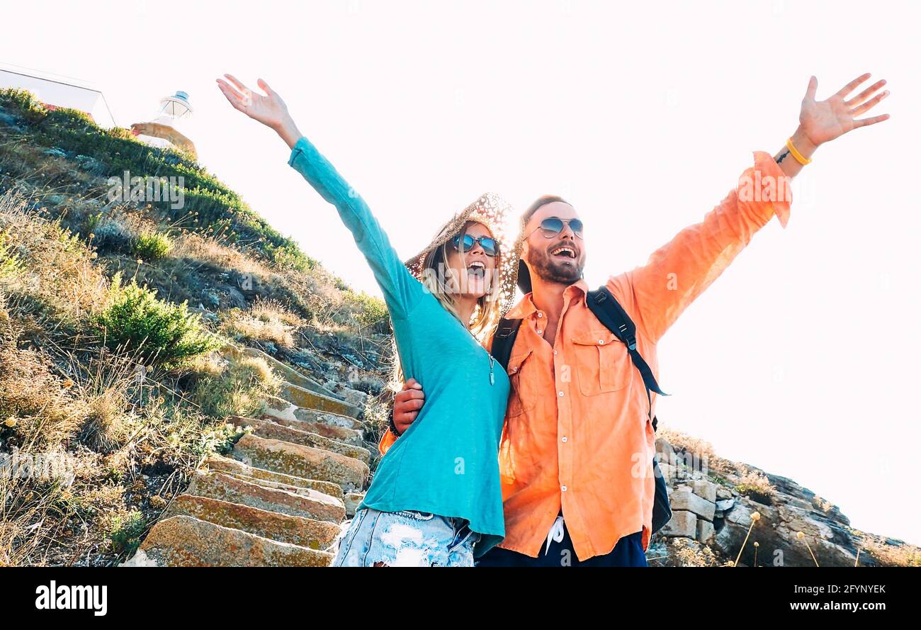 Happy boyfriend and girlfriend in love having genuine fun at travel excursion - Wanderlust life style and vacation concept with tourist couple Stock Photo