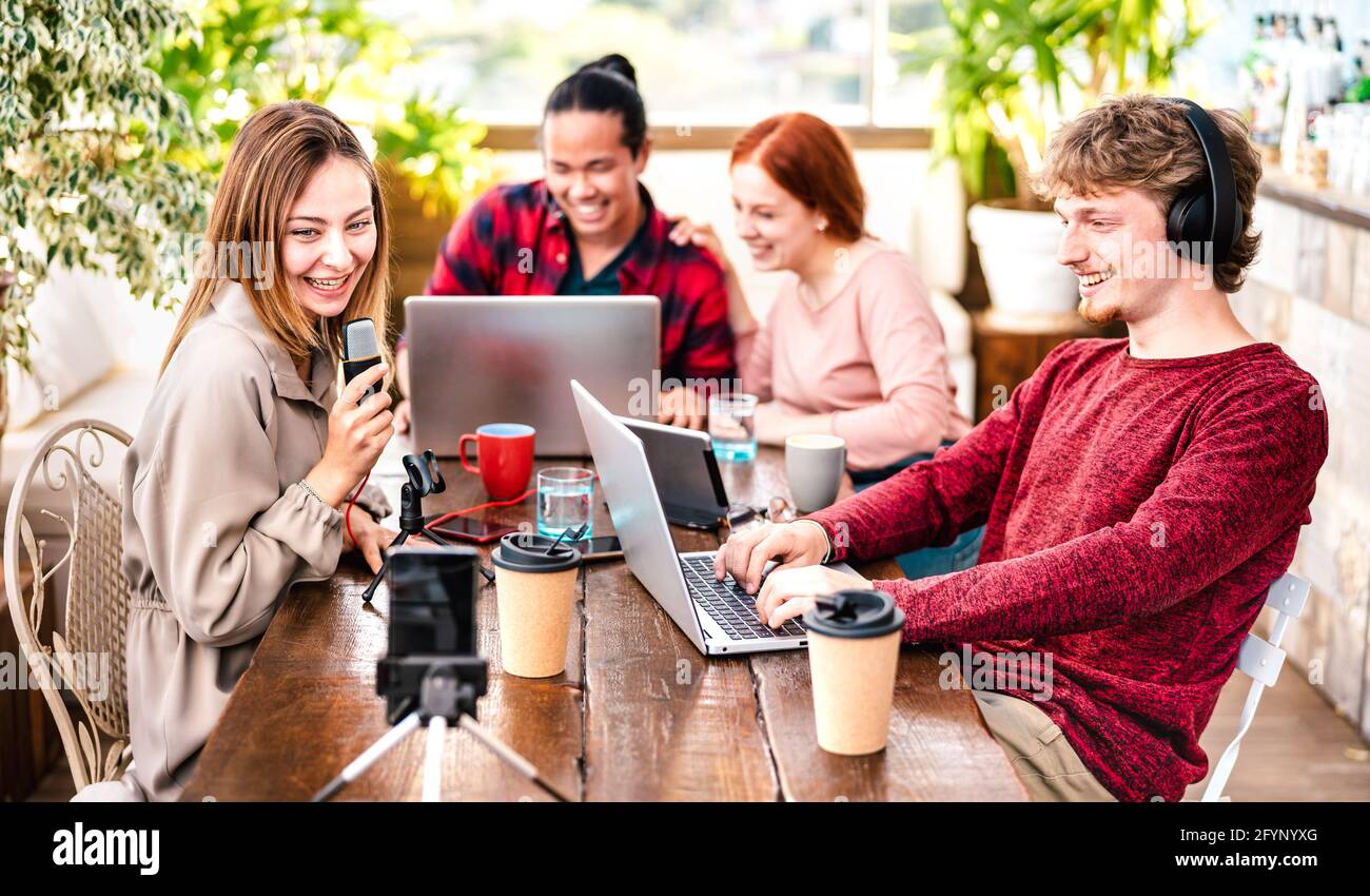 Happy people sharing content on streaming platforms with digital web cam - Modern life style concept with guys and girls speaking and having fun Stock Photo