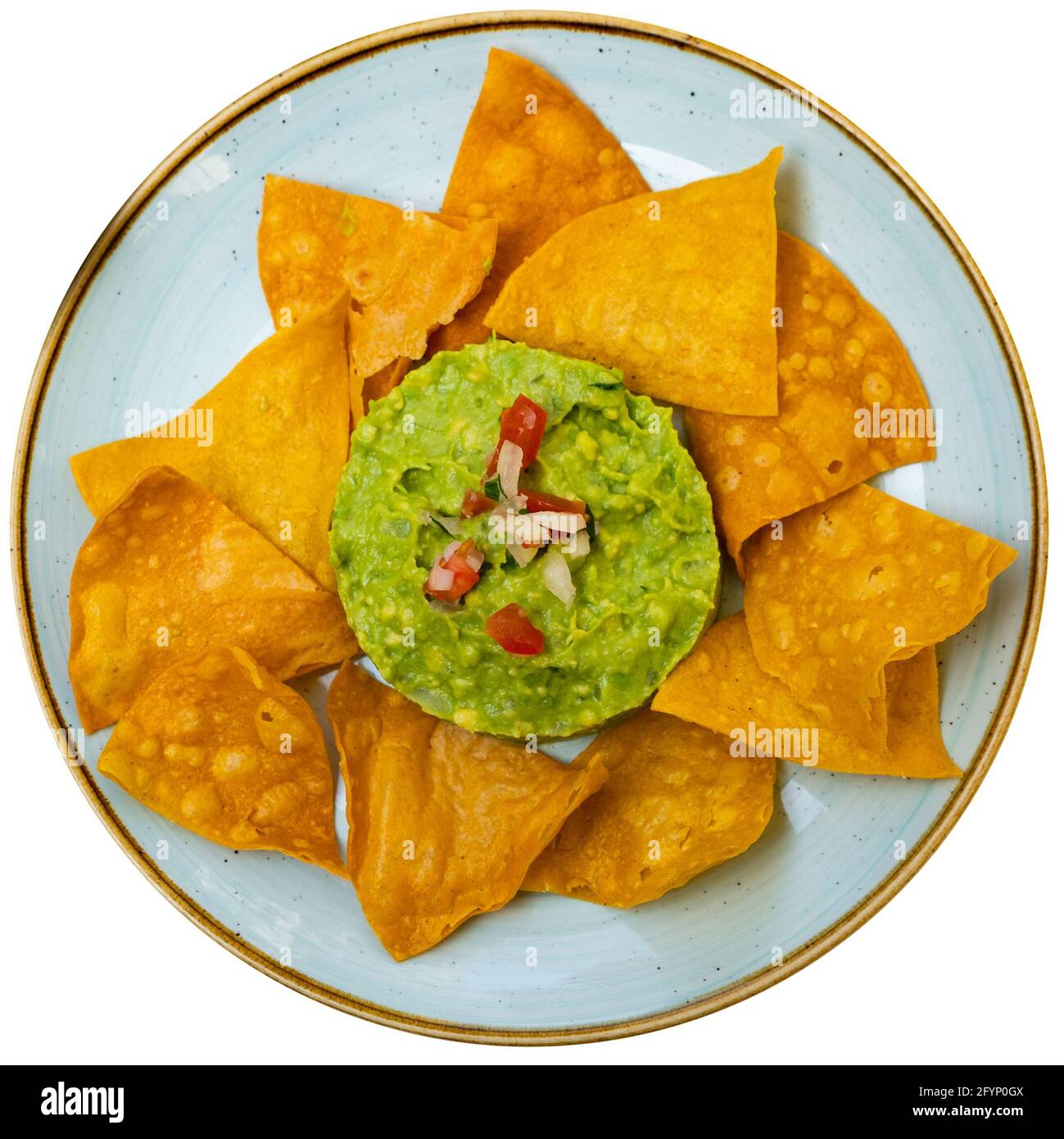 Corn chips with guacamole sauce. Mexican food. Isolated over white