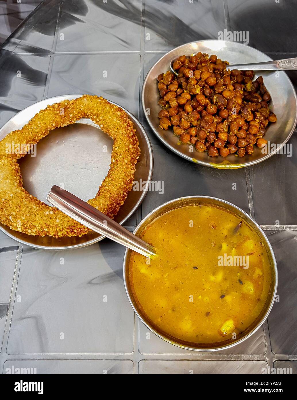 Nepalese food breakfast with Sel Roti and chickpeas. Ring Road in
