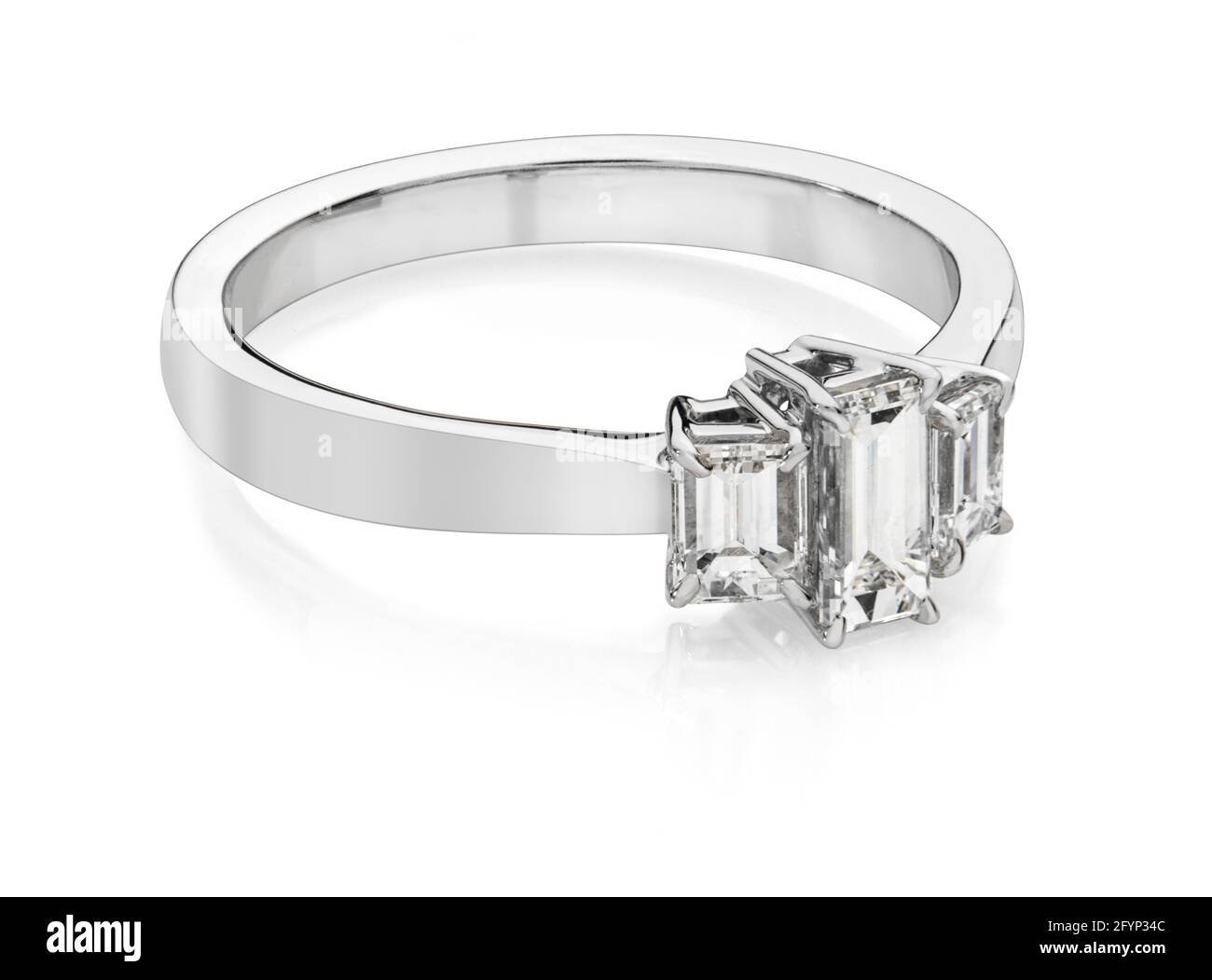 Three emerald cut diamond engagement ring in white gold or platinum Stock Photo