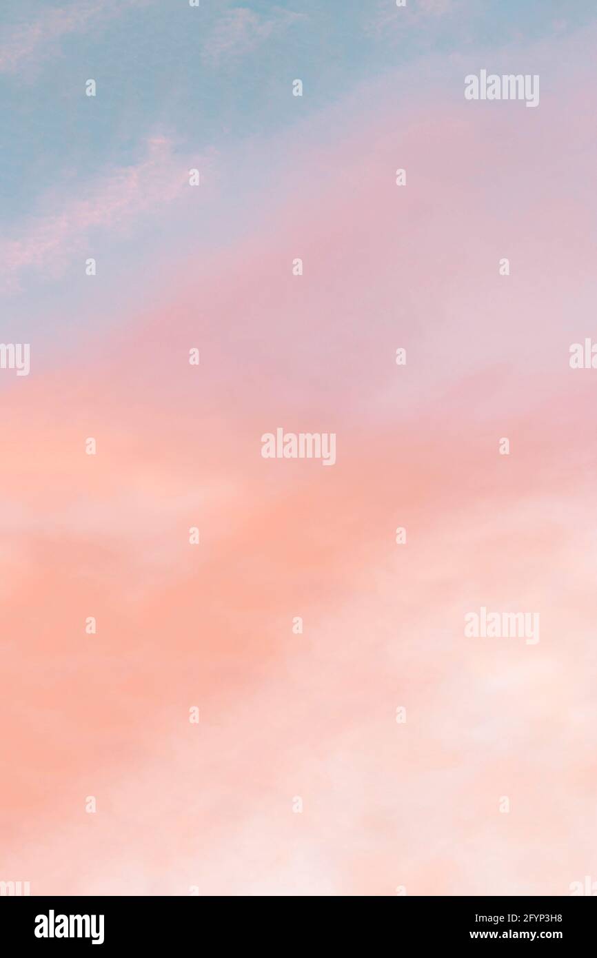 Vertical background formed by a bright pastel authentic sky during ...