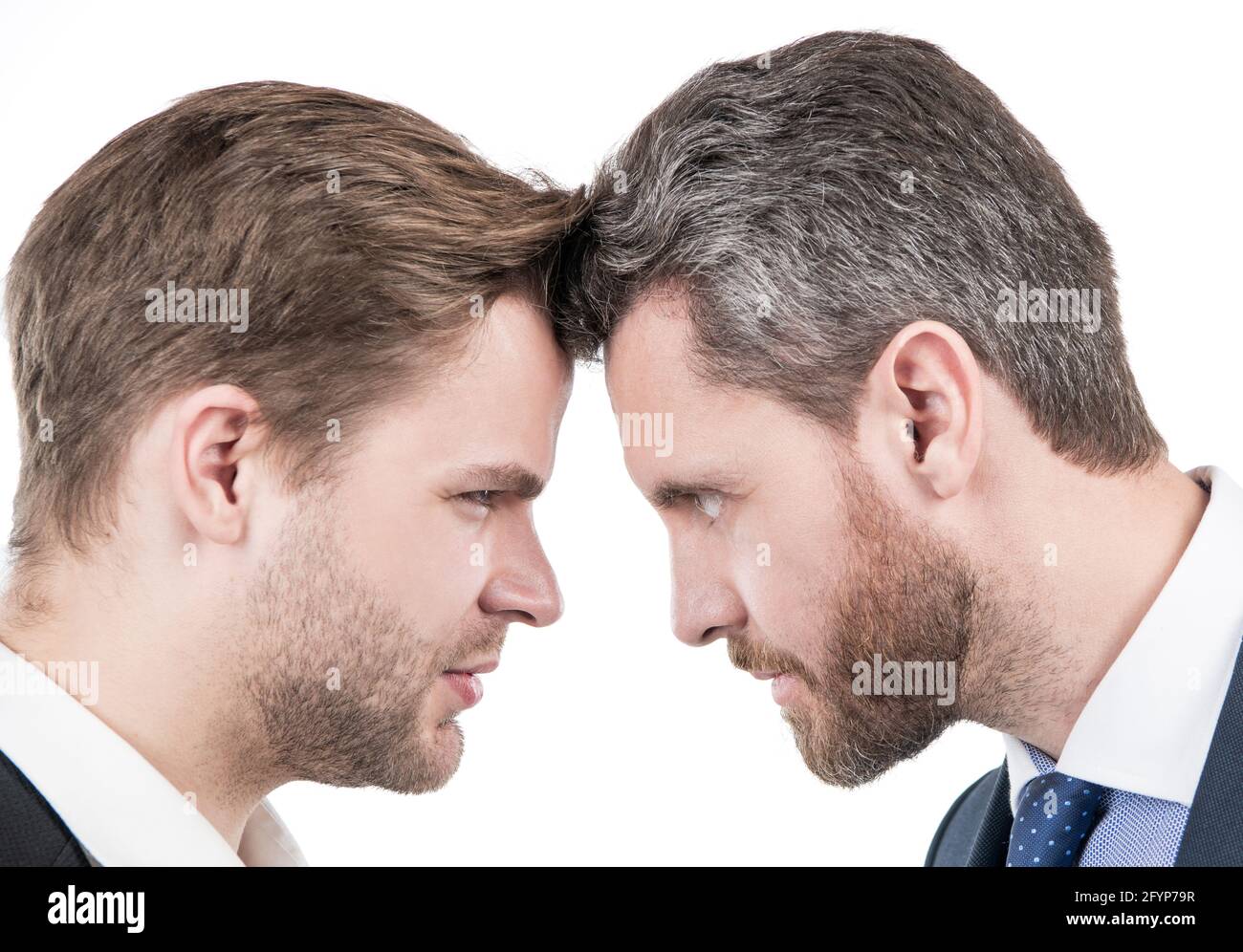 two businessmen starring to each other in business conflict, disagreement Stock Photo