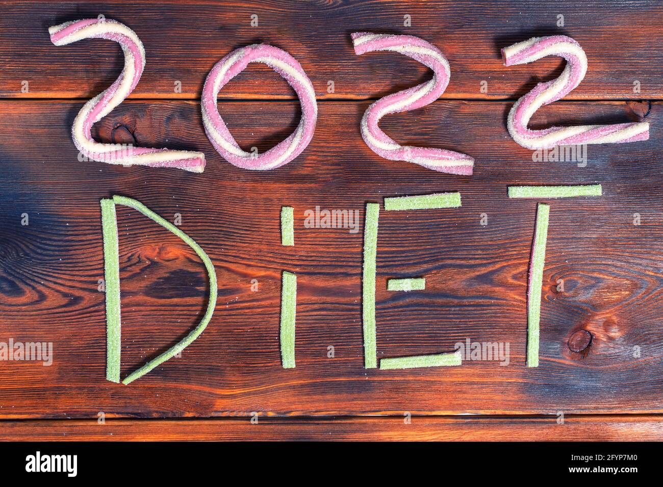 2022 and jujube diet text on wooden background Stock Photo