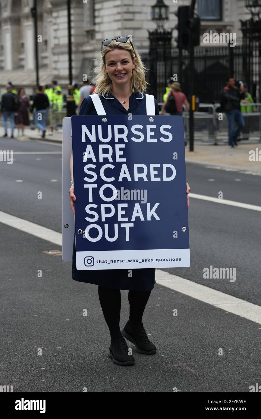 London, UK. 29th May, 2021. Unite for Freedom no COVID passports protestors holding banners march for freedom against Vaccine Passports in London, on 29th May 2021. Credit: Picture Capital/Alamy Live News Stock Photo