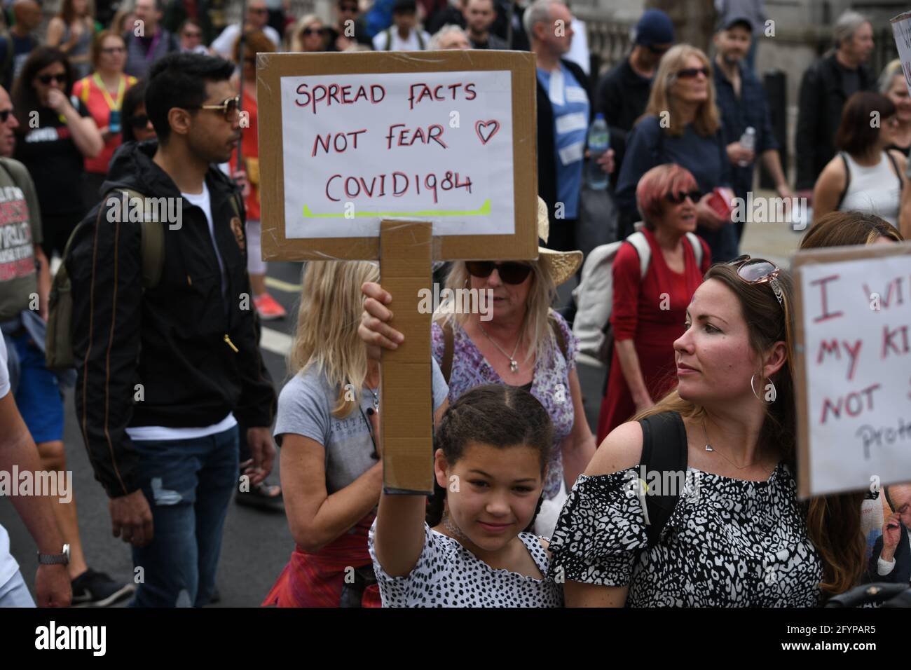 London, UK. 29th May, 2021. Unite for Freedom no COVID passports protestors holding banners march for freedom against Vaccine Passports in London, on 29th May 2021. Credit: Picture Capital/Alamy Live News Stock Photo