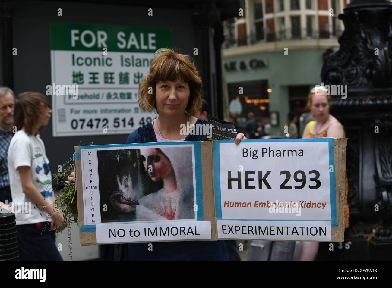 London, UK. 29th May, 2021. Unite for Freedom no COVID passports protestors holding banners march for freedom against Vaccine Passports in London, on 29th May 2021. Credit: Picture Capital/Alamy Live News Stock Photo