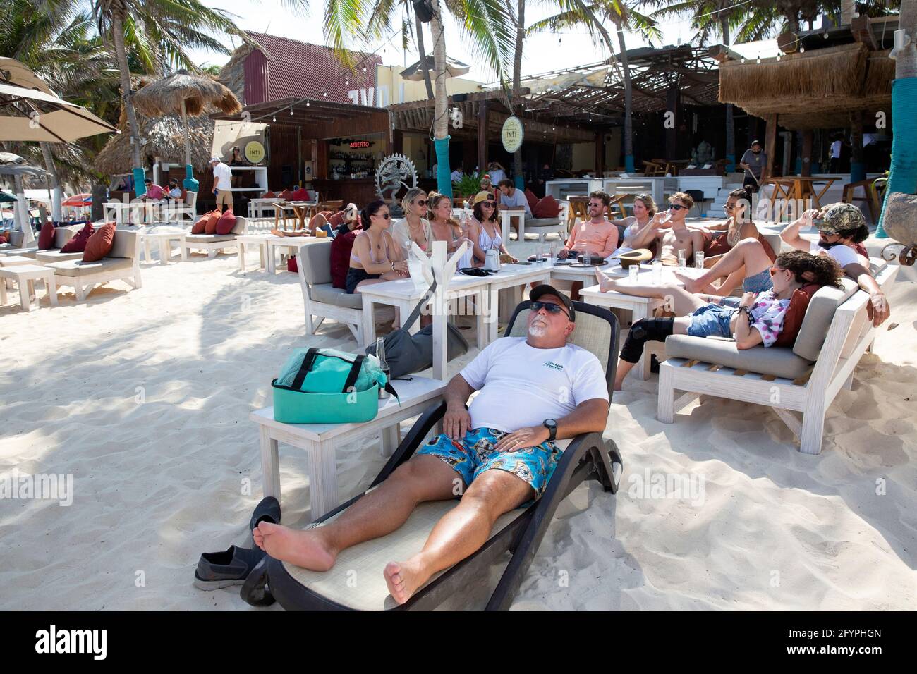 A group of American tourists gather at a beach bar amid the coronavirus  pandemic in Playa del Carmen, Quintana Roo state, Mexico, on April 30,  2021. The group of friends have all