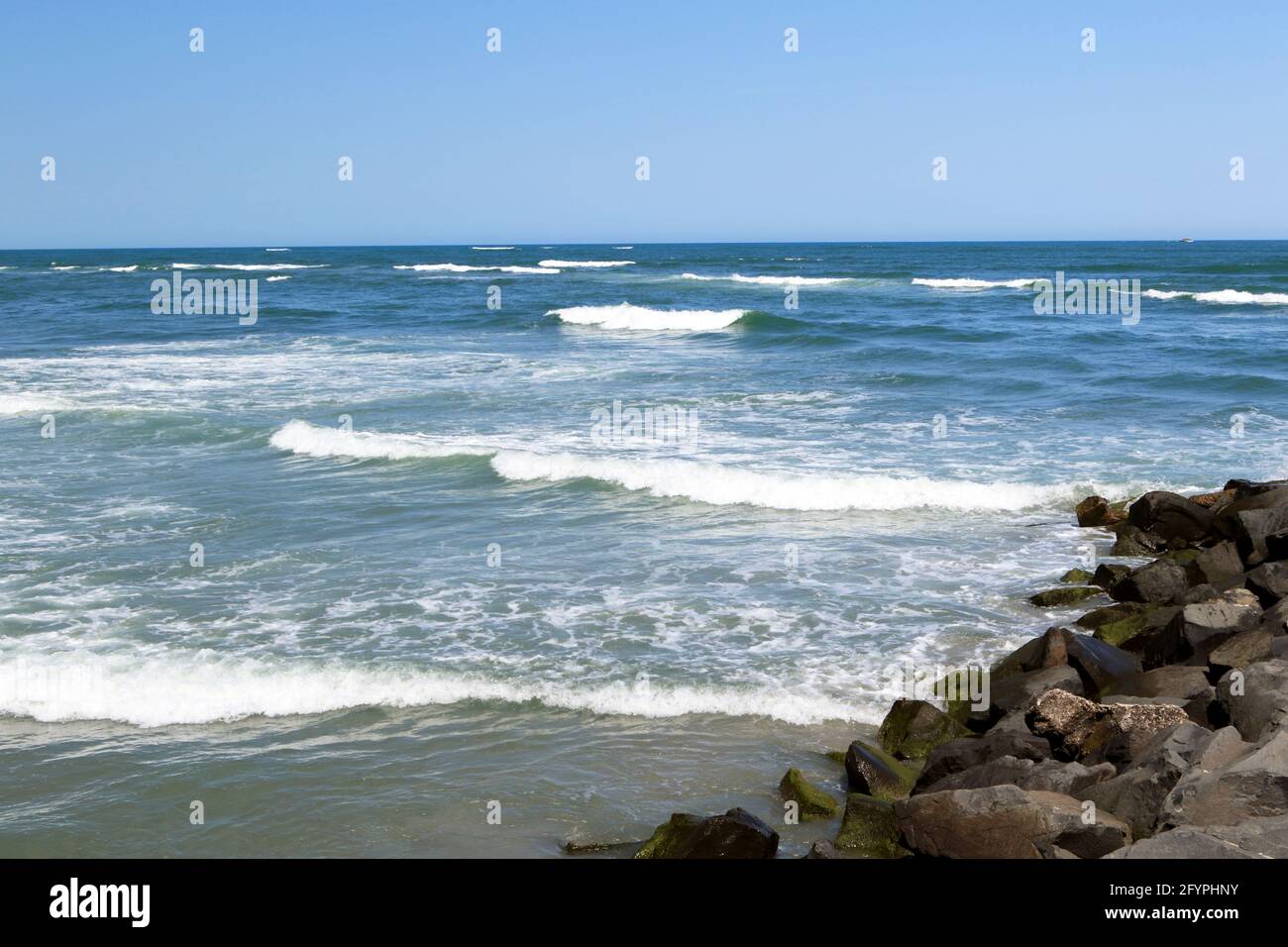 A jetty in North Wildwood, New Jersey where the Atlantic Ocean and the Hereford Inlet meet. The waters are dangerous as are many inlet waters. Stock Photo