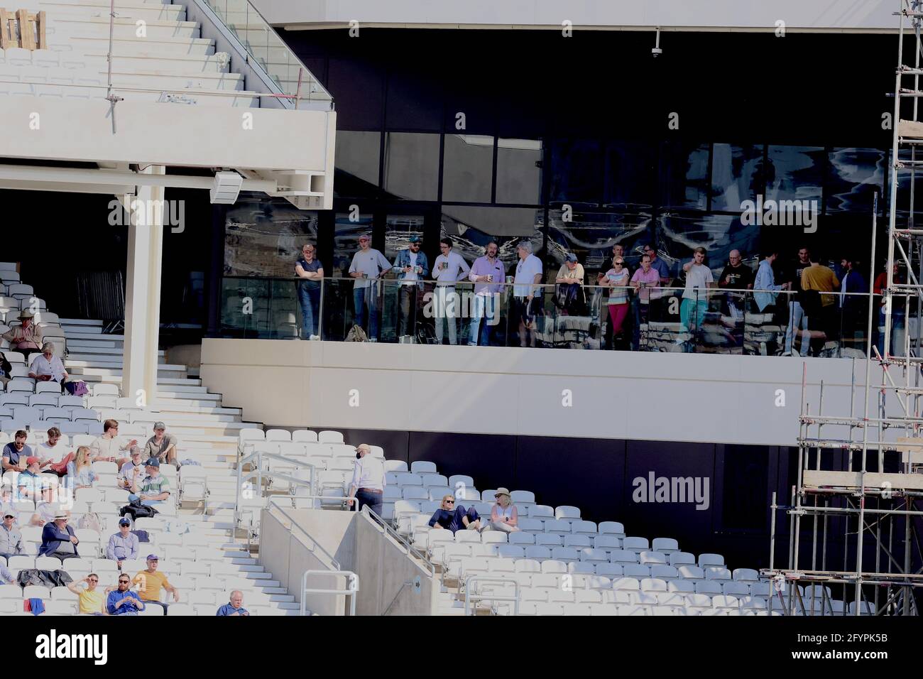 London, UK. 29 May, 2021. London, UK. Spectators on the new balcony enjoy cricket in the sun as Surrey take on Gloucestershire in the County Championship at the Kia Oval, day three David Rowe/Alamy Live News Stock Photo