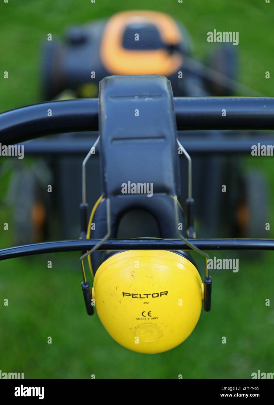 Peltor hearing protection on a lawn mower Stock Photo Alamy