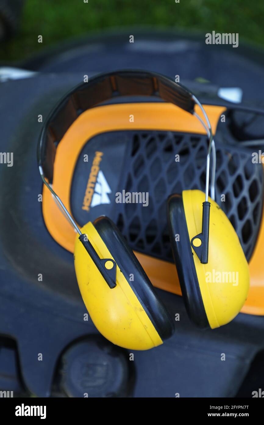 Peltor hearing protection on a lawn mower Stock Photo Alamy