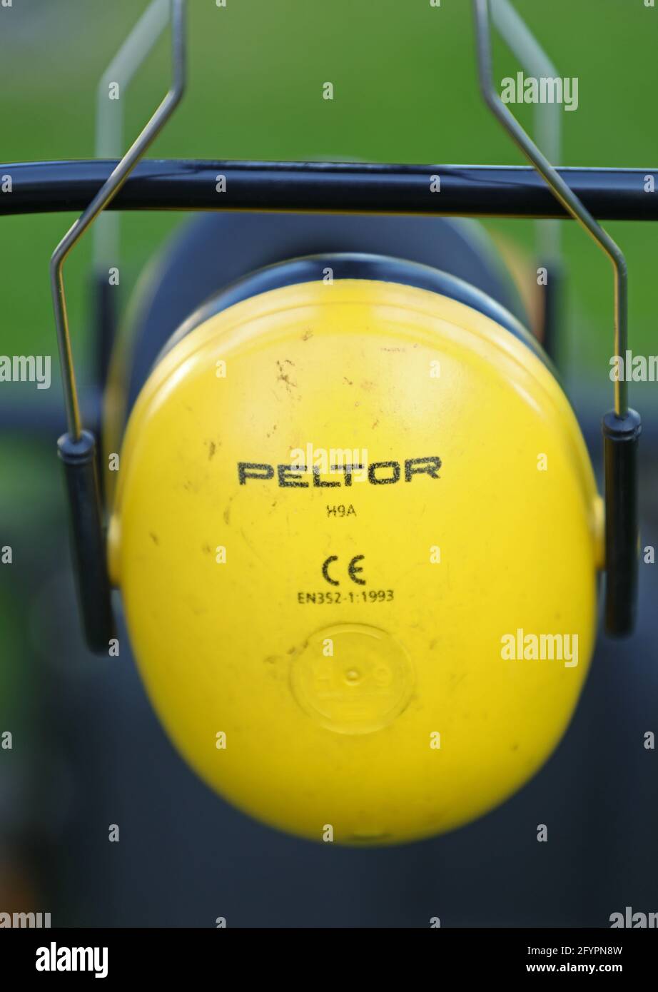 Peltor hearing protection on a lawn mower Stock Photo Alamy