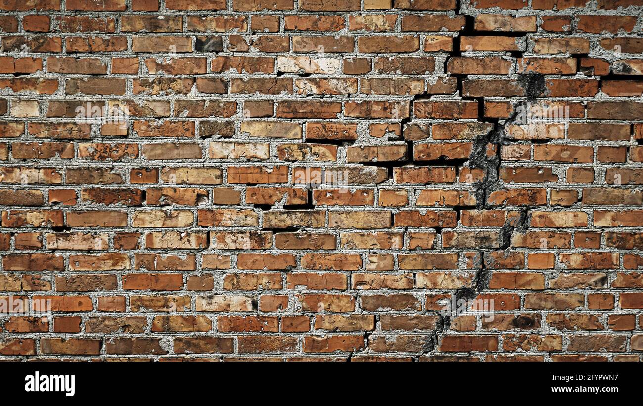 Creative background red brick wall with crack. Antique brick wall. Copy space Stock Photo
