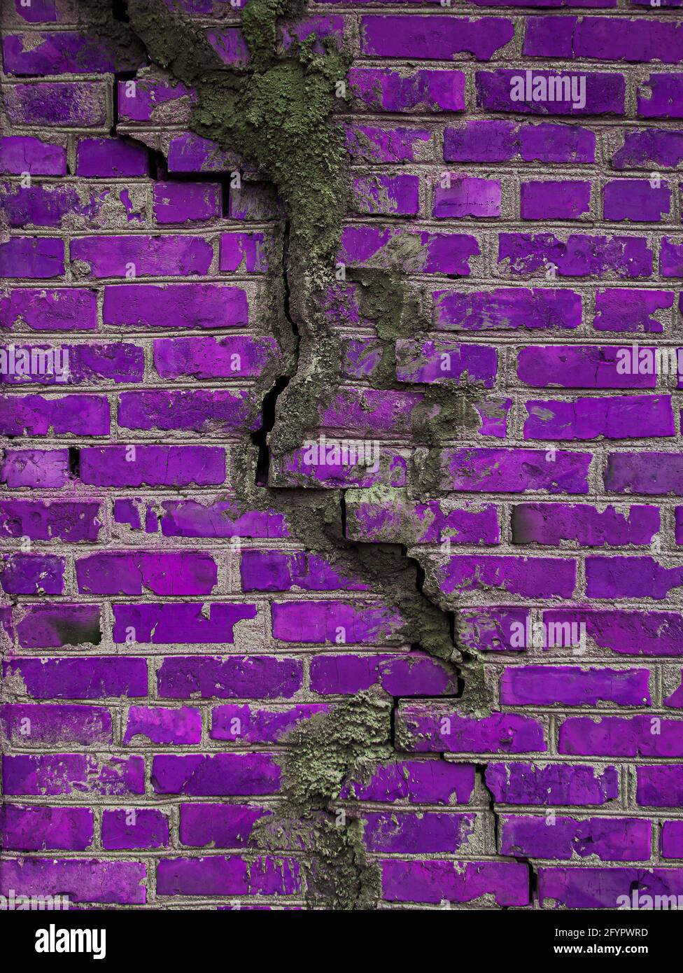 Texture of a brick wall with cracks in purple. Destroyed ancient wall violet. Brick background