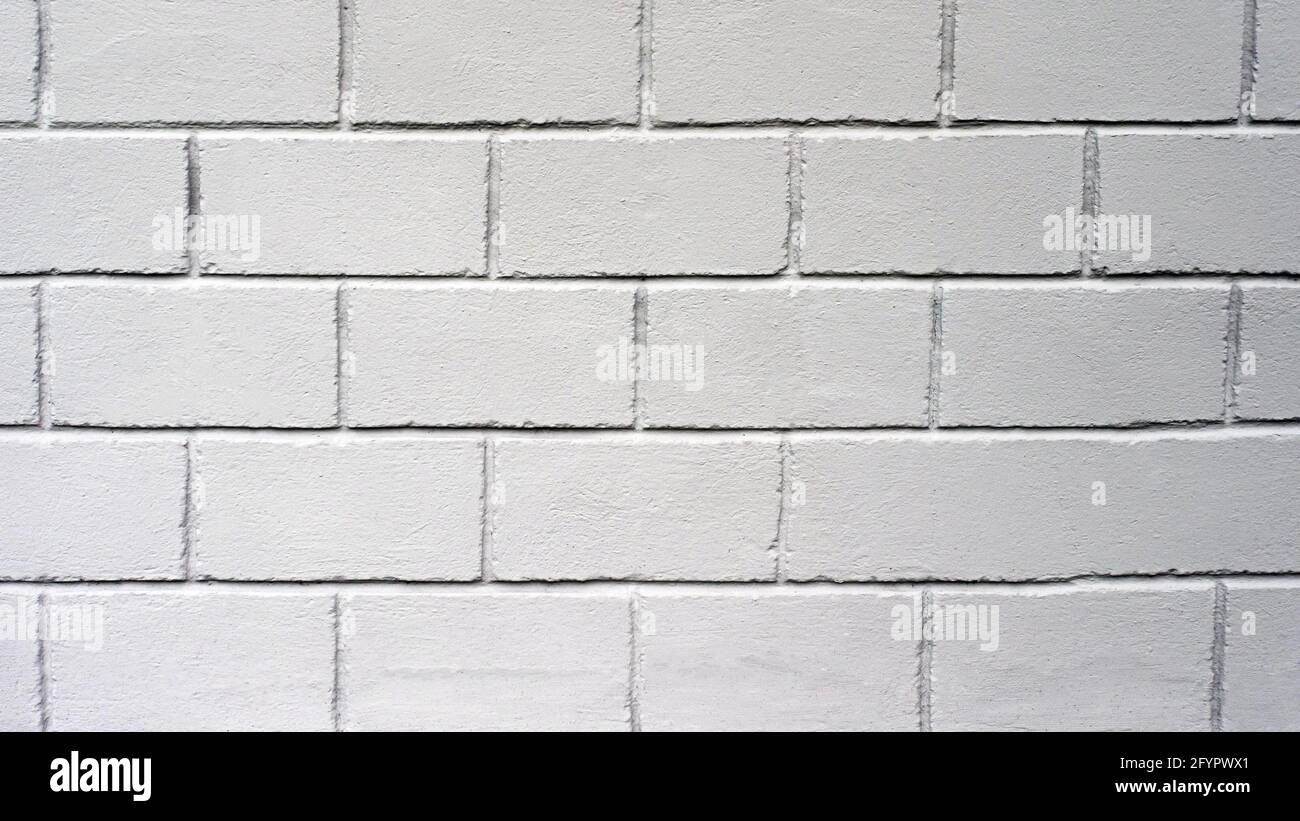 Wall texture from square gray blocks. Loft wall. Decorative concrete wall. Copy space. Stock Photo