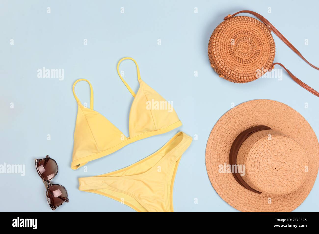 Swimming suit with sunglasses and hat Stock Photo
