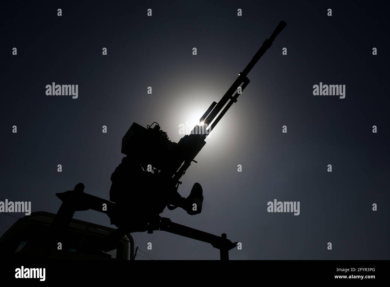 Gaza, Palestine. 29th May, 2021. Silhouette of Izz al-Din al-Qassam Brigades gunmen during an anti-Israel military parade in Rafah, southern Gaza Strip. Credit: SOPA Images Limited/Alamy Live News Stock Photo