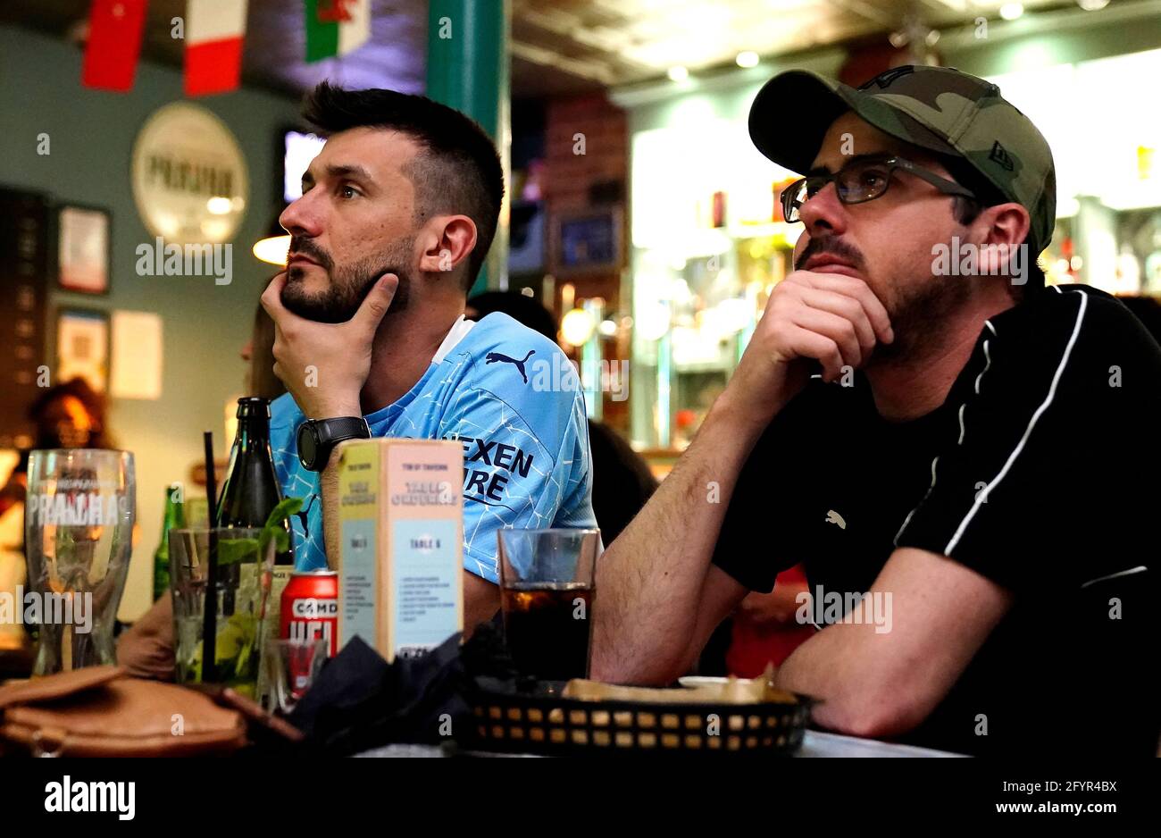 Manchester City fans in the Tib Street Tavern during the UEFA Champions League Final between Manchester City and Chelsea. Picture date: Saturday May 29, 2021. Stock Photo