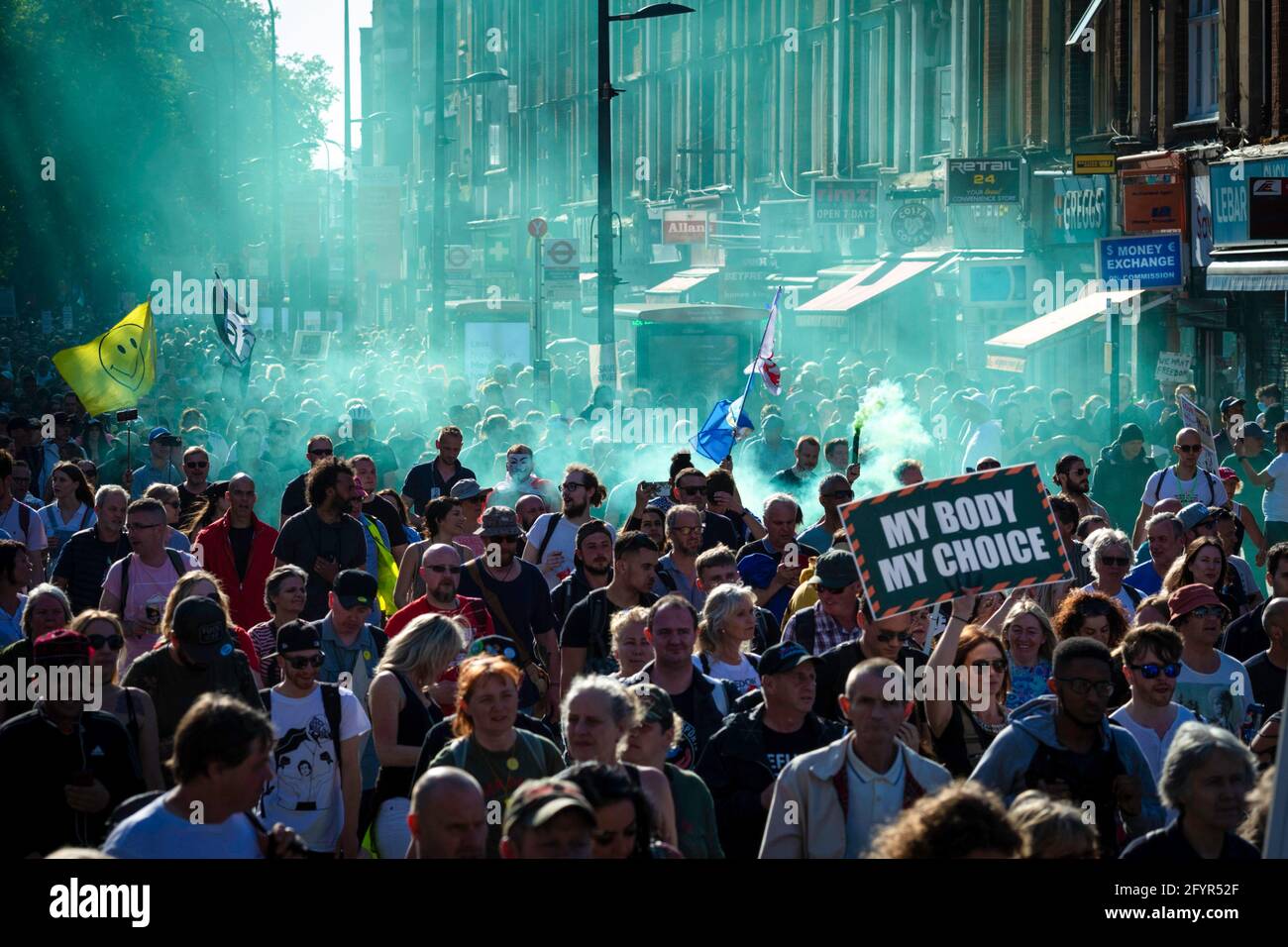 London, UK. 29th May, 2021. People march through the city during an anti-lockdown protest. Thousands of people came out under the banner to Unite for Peace and their Human Rights. The number of people attending the protests has increased month on month since the introduction of the COVID-19 restrictions. Credit: SOPA Images Limited/Alamy Live News Stock Photo