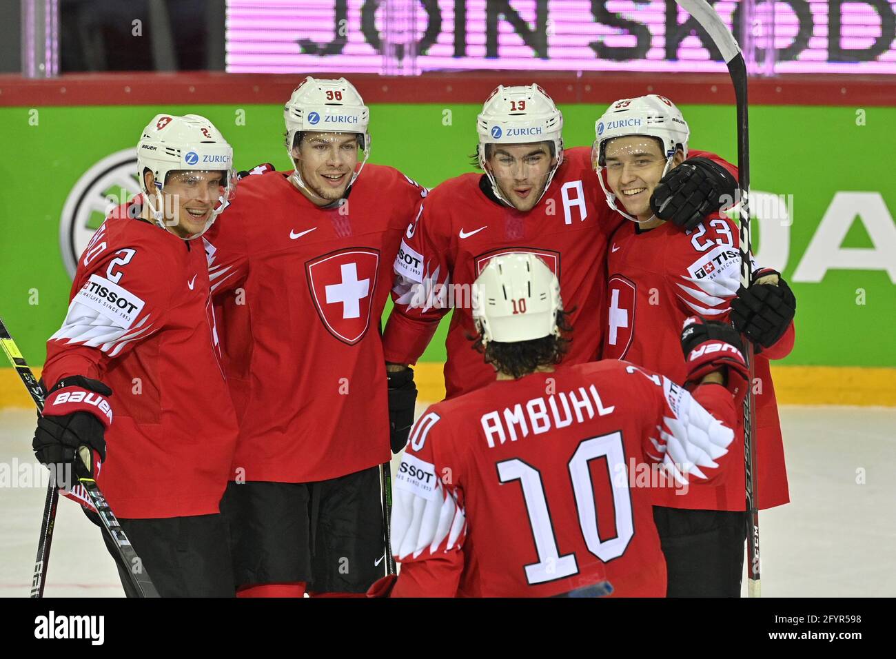 Nico Hischier of Switzerland, right, celebrates after scoring his sides 4th goal during the group A Hockey World Championship match between Switzerland and Slovakia in Helsinki, Finland, Wednesday May 18, 2022