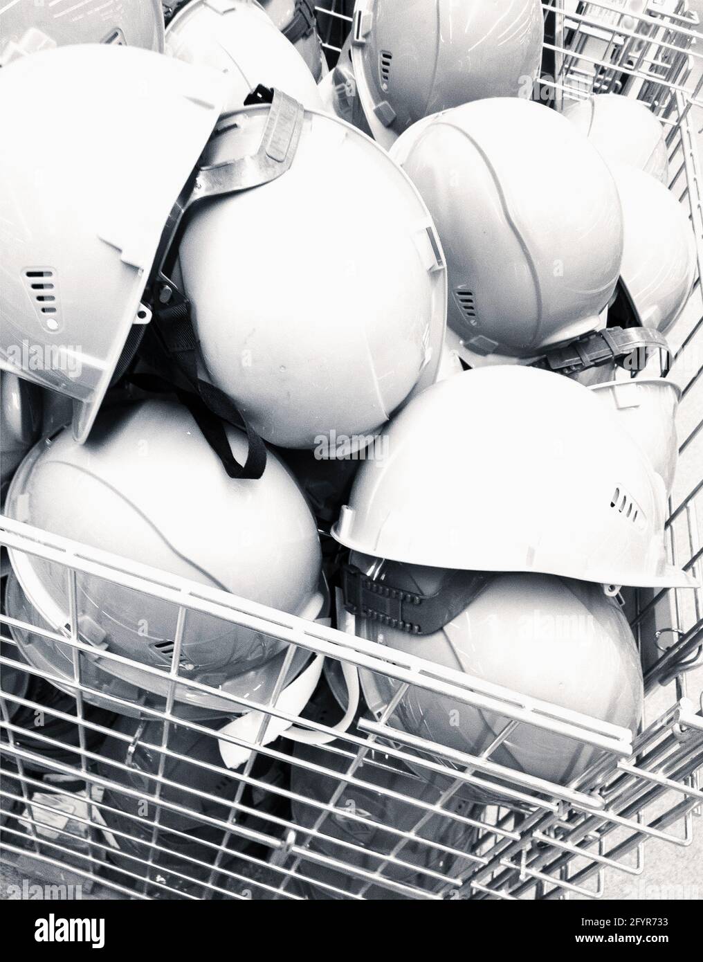 a heap of construction helmets Stock Photo