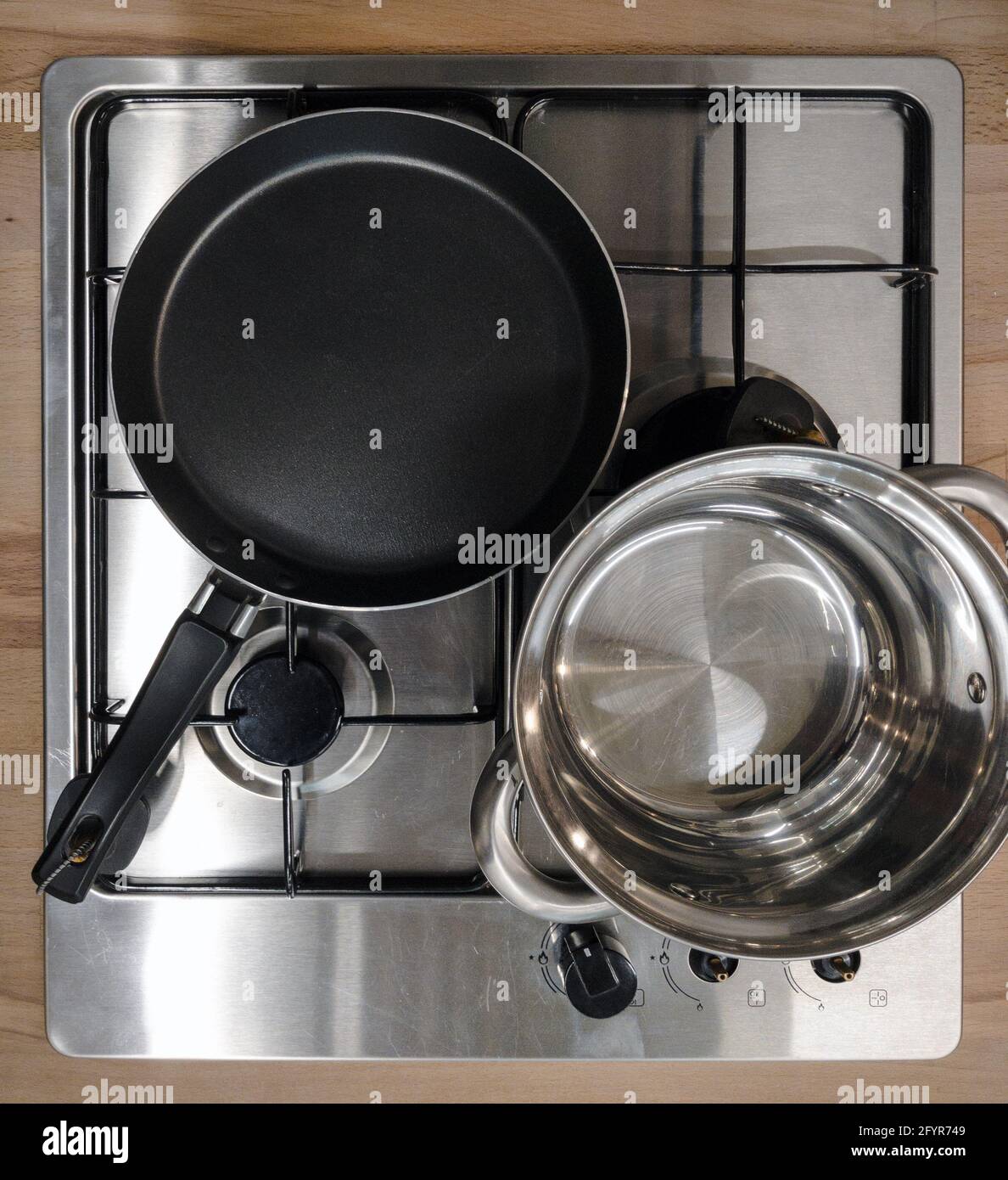 new inbuilt gas stove with pans, above Stock Photo Alamy